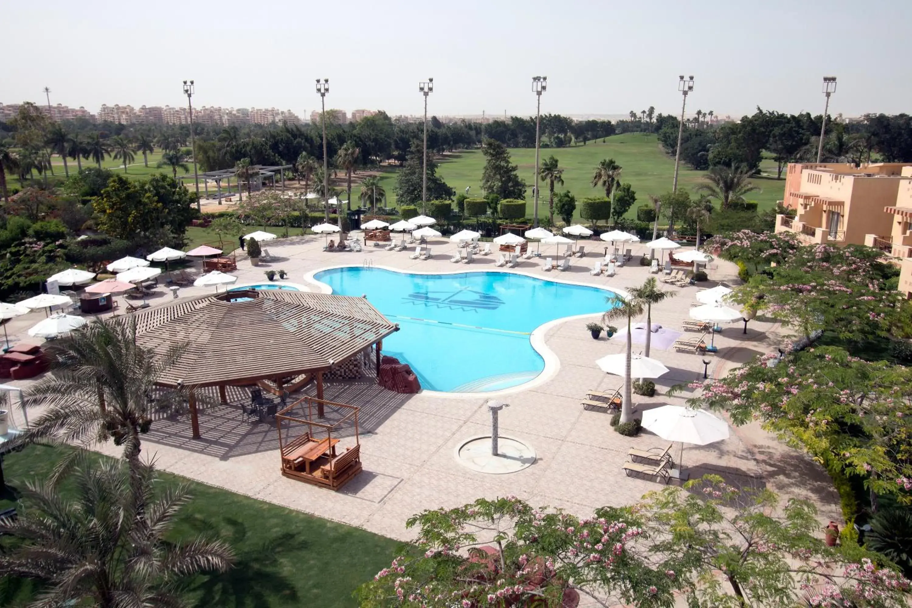 Pool view in Swiss Inn Pyramids Golf Resort Pool view in Swiss Inn Pyramids Golf Resort