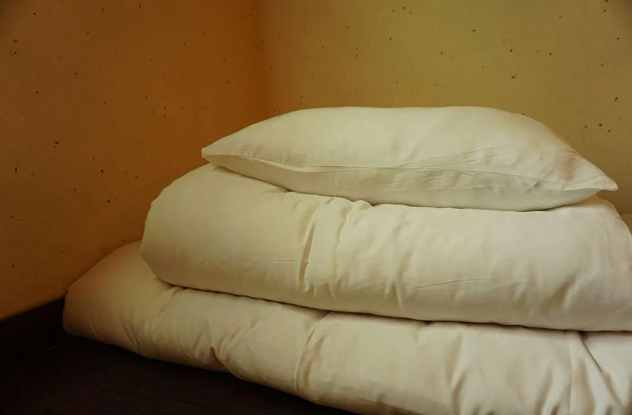 Bed in Grim Garden Guesthouse