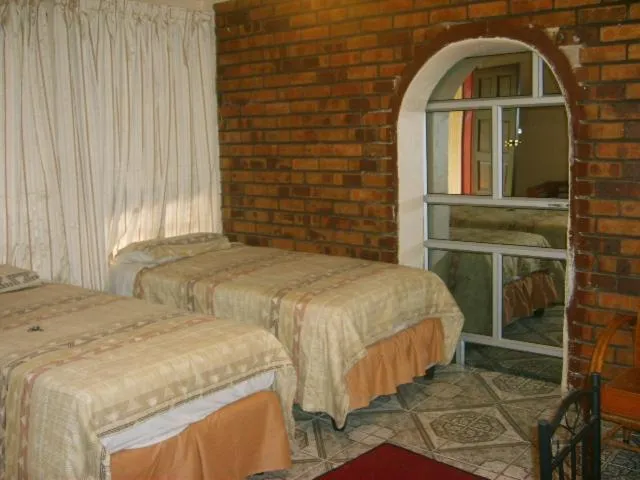 Bed in All Are Welcome Guest House