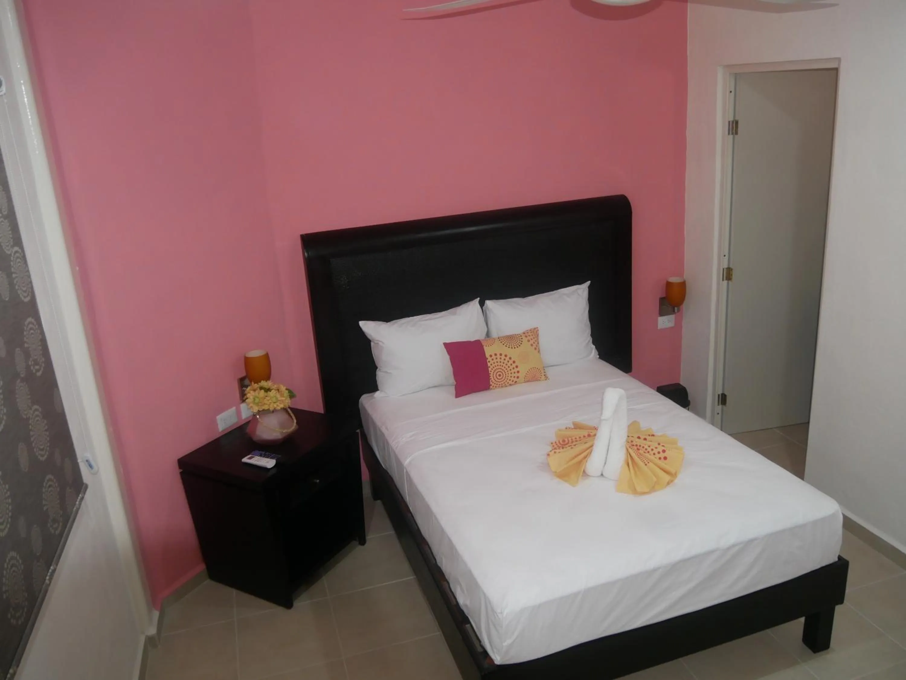 Photo of the whole room, Bed in Hotel Real San Juan Suites