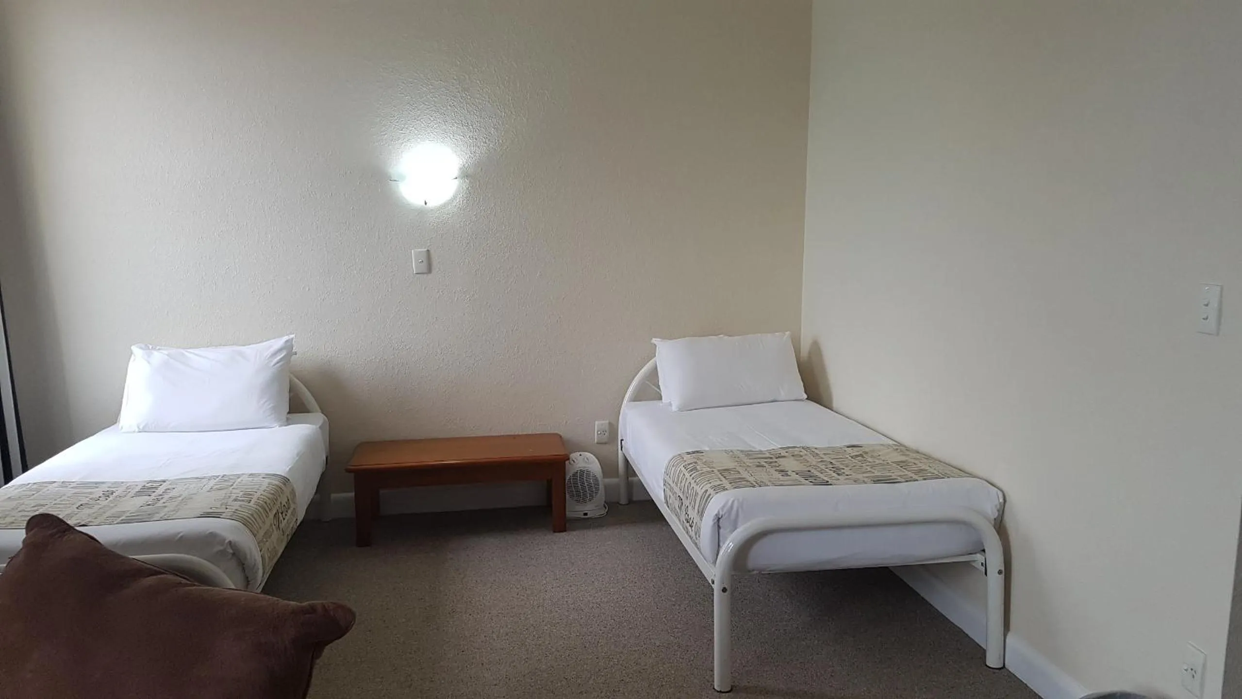 Bed in Whakatane Hotel