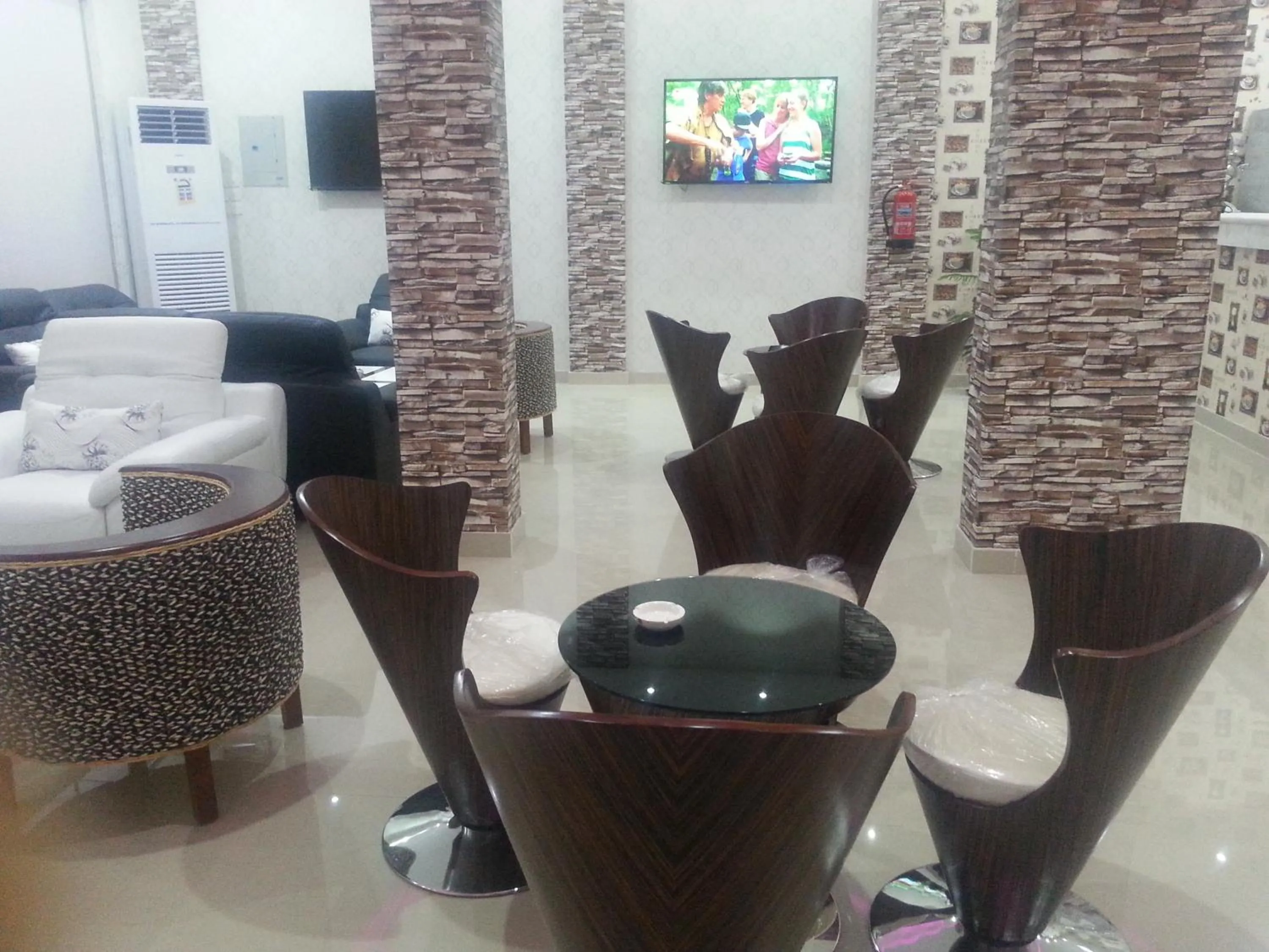 Communal lounge/ TV room in Lara Al Jawf Hotel Apartments