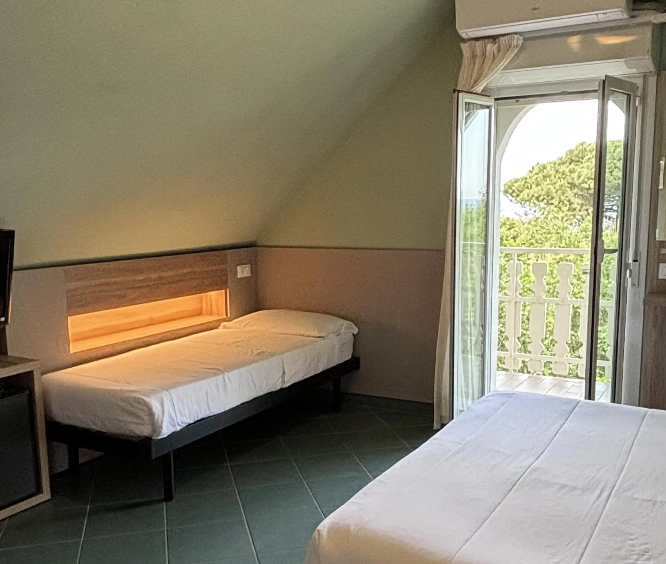 Bed in Pinetina Mare Baby Family Hotel