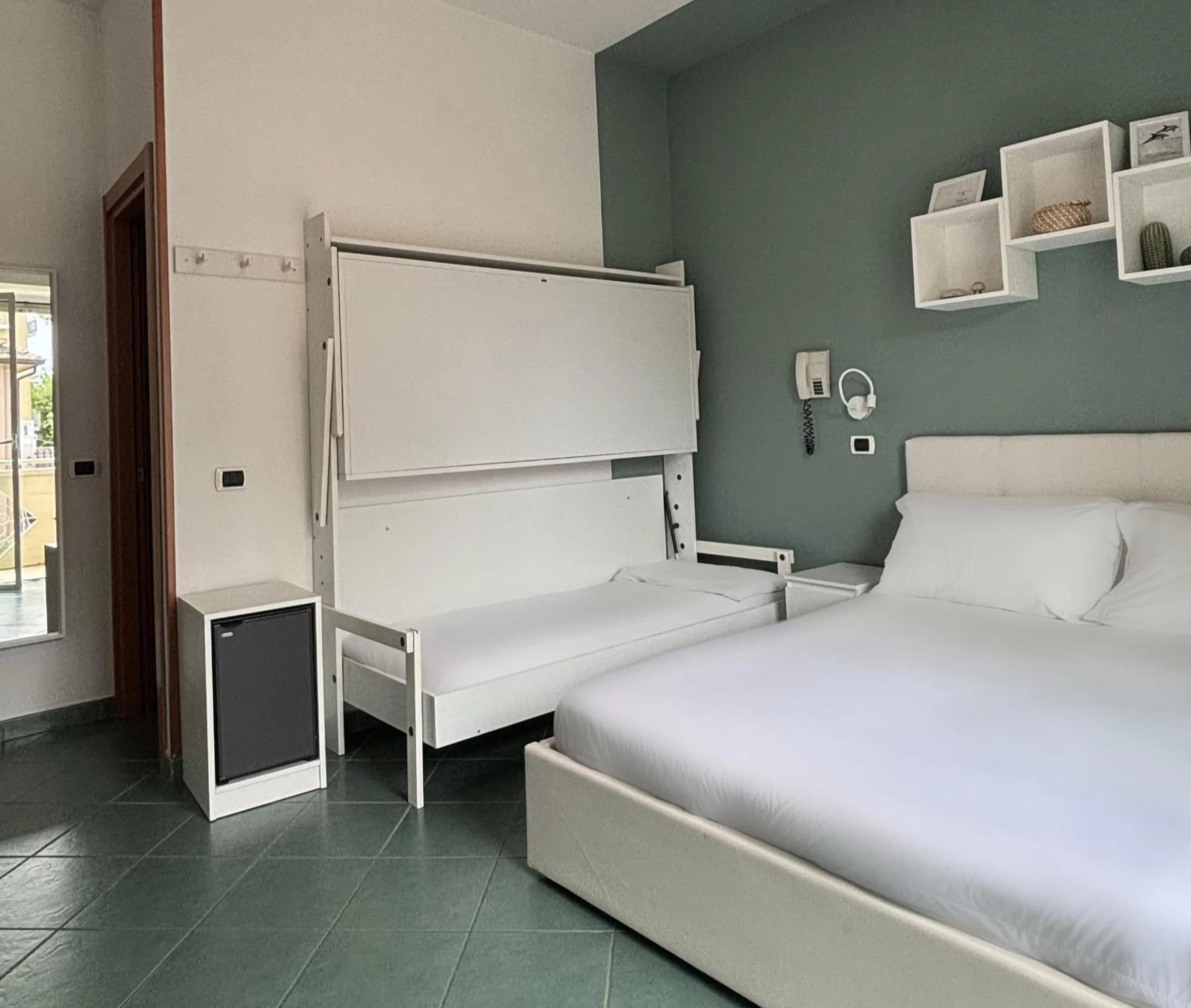 Bed in Pinetina Mare Baby Family Hotel