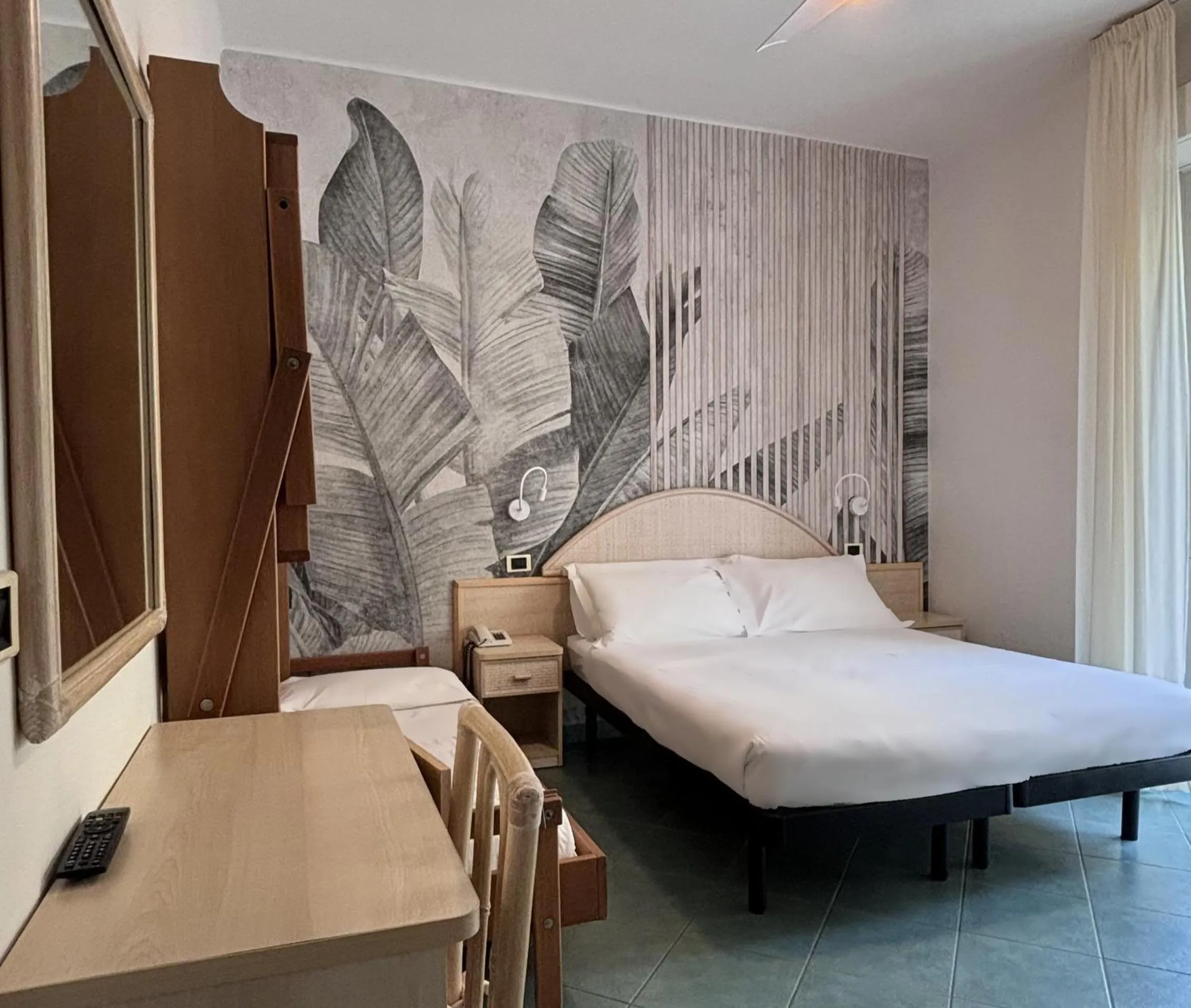 Bed in Pinetina Mare Baby Family Hotel