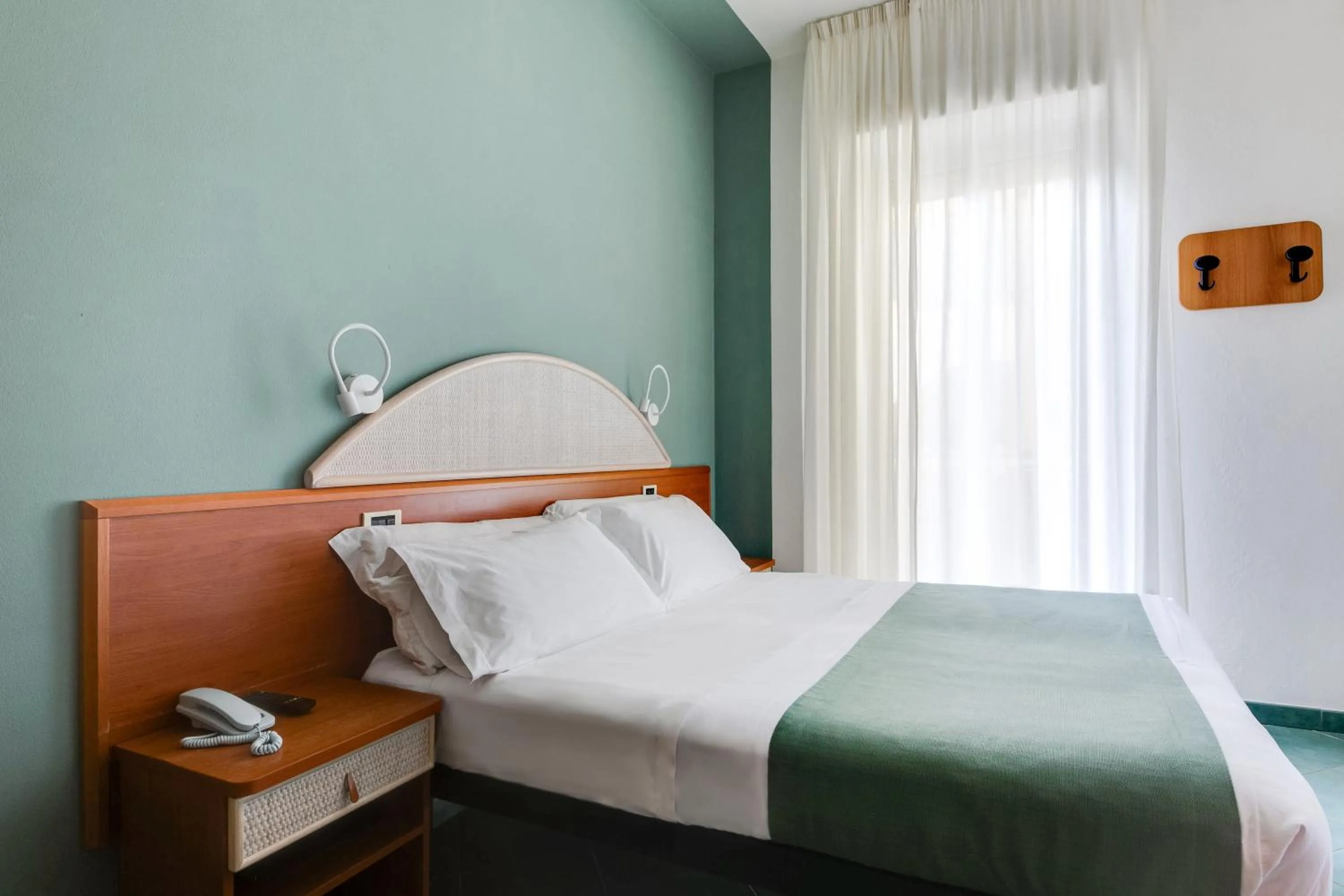 Bed in Pinetina Mare Baby Family Hotel