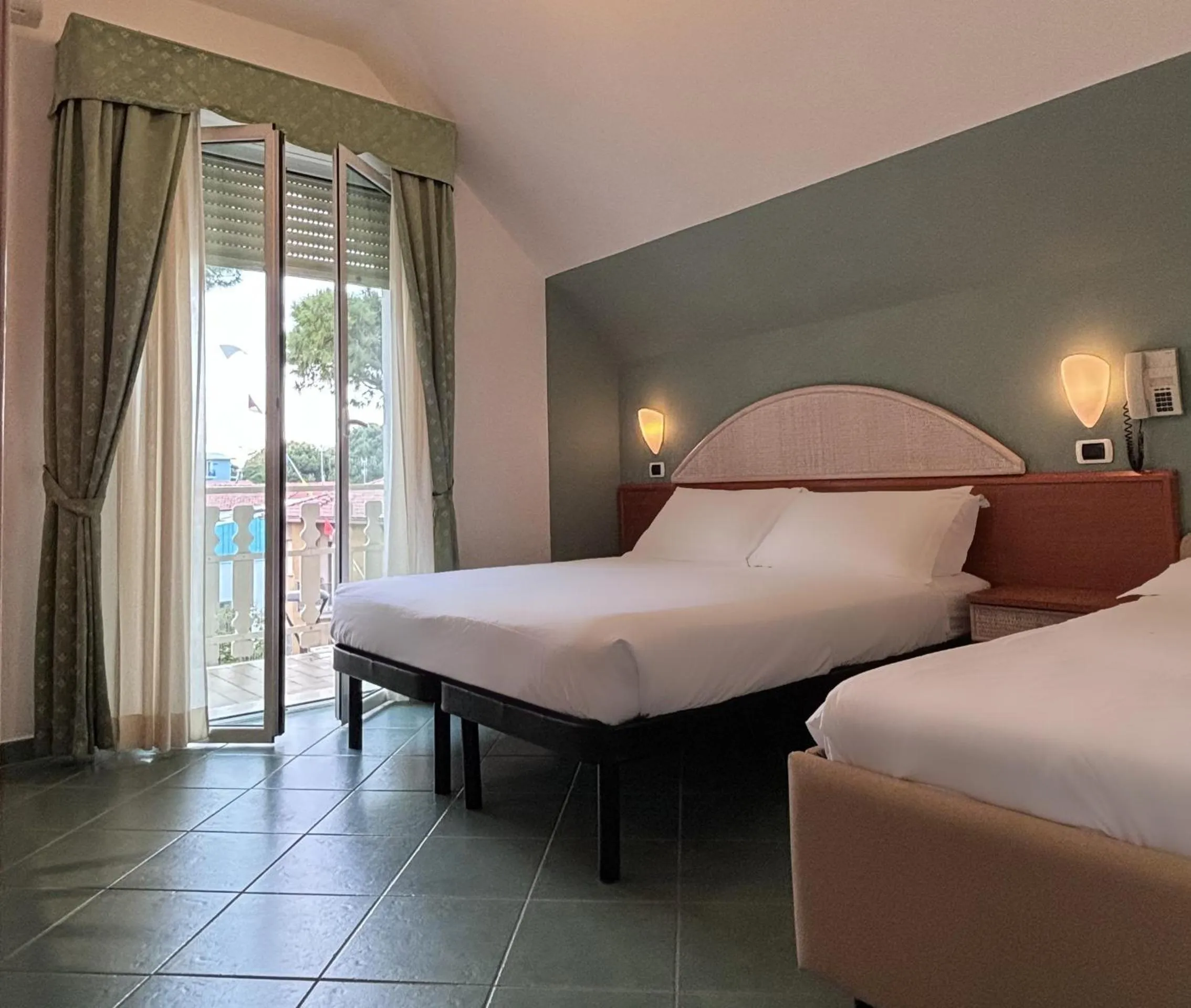 Bed in Pinetina Mare Baby Family Hotel