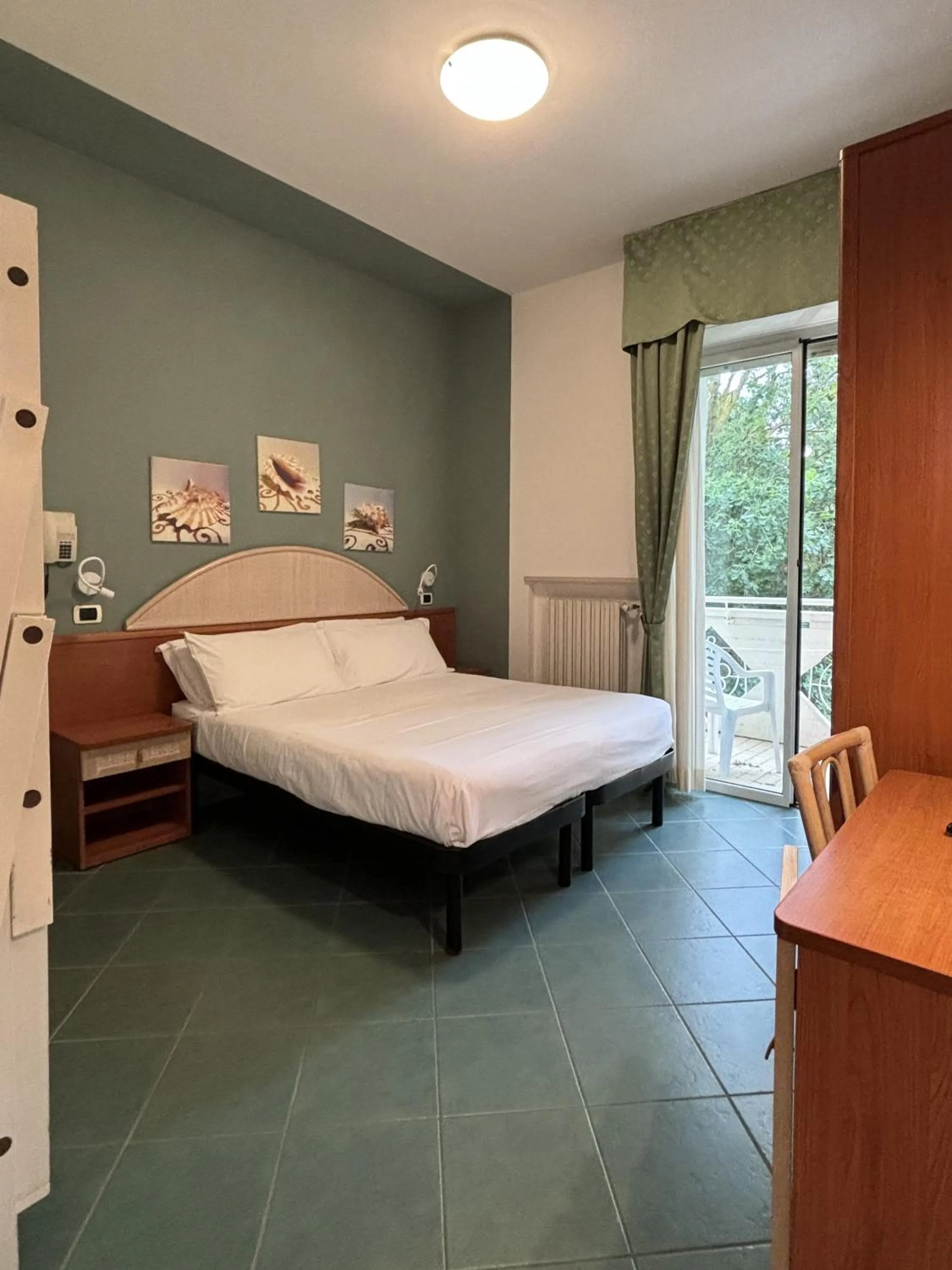 Bed in Pinetina Mare Baby Family Hotel