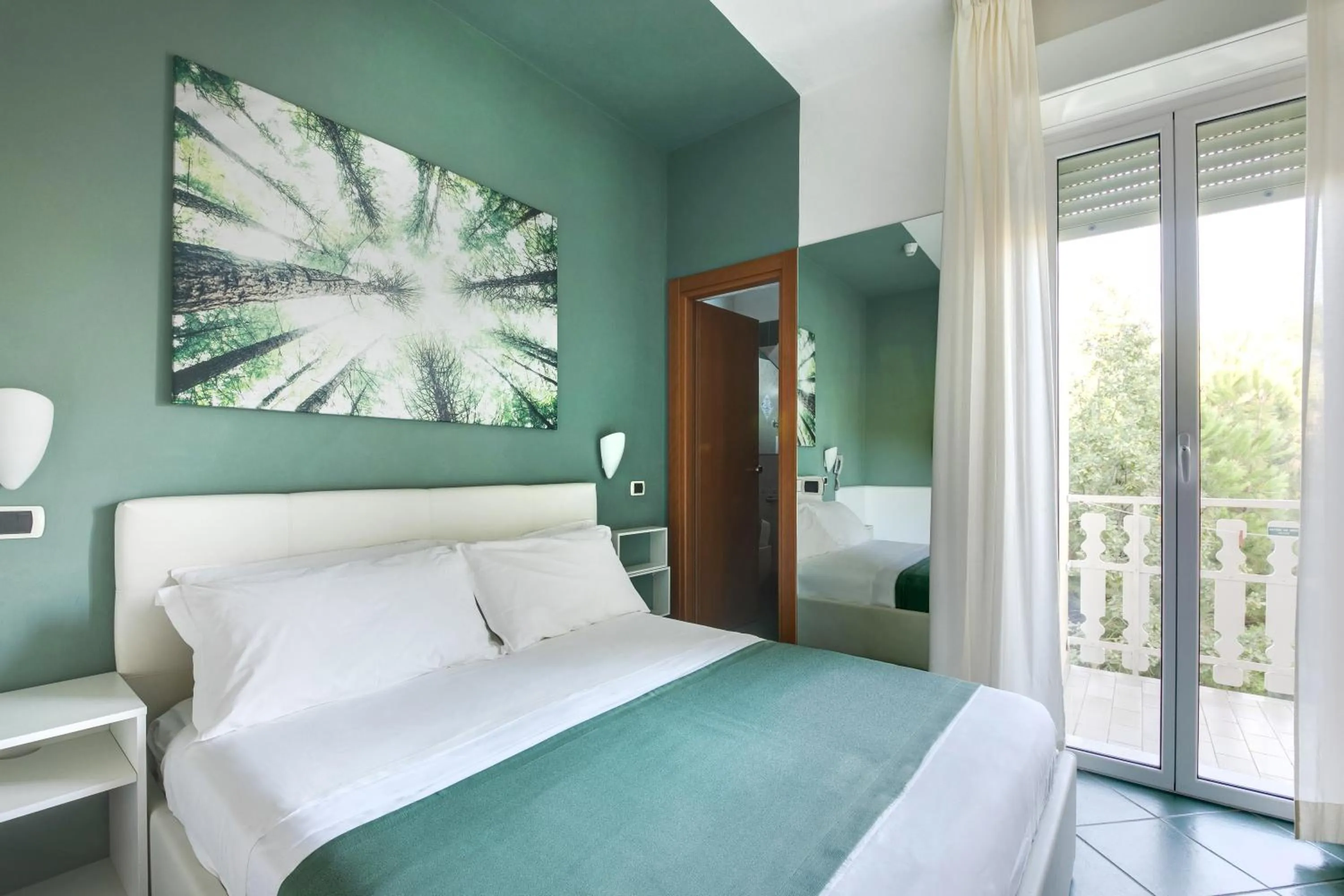 Bed in Pinetina Mare Baby Family Hotel