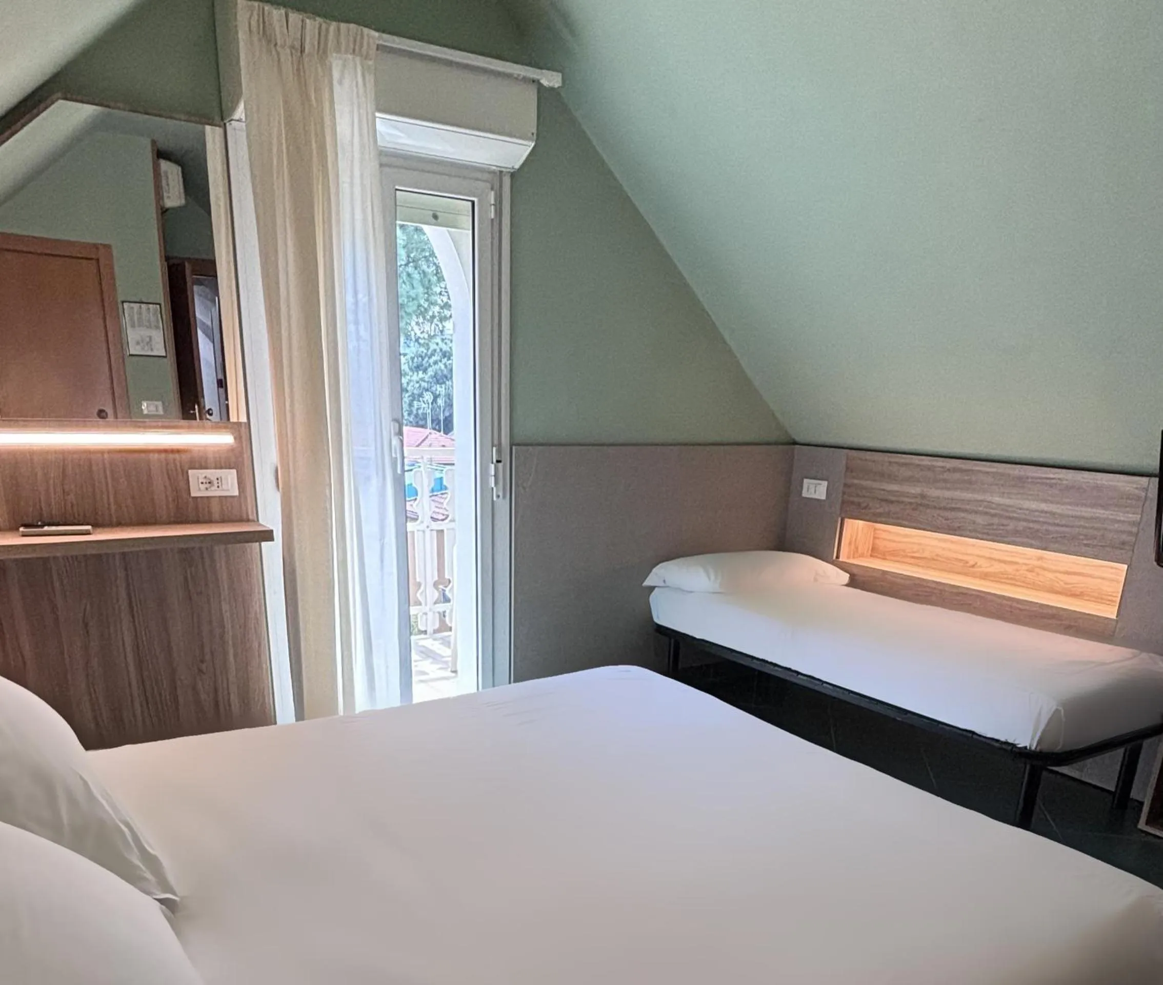 Bed in Pinetina Mare Baby Family Hotel