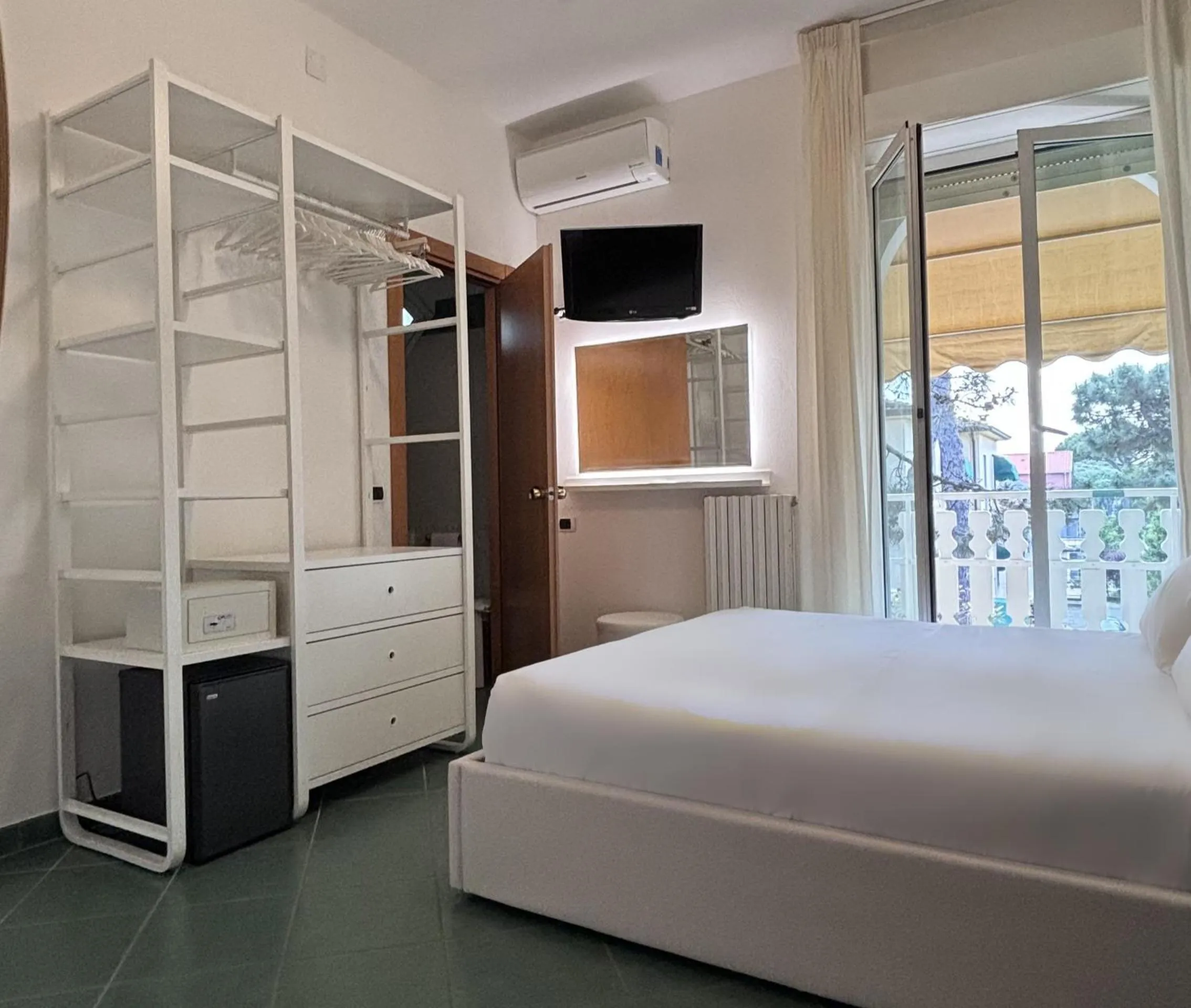 Bed in Pinetina Mare Baby Family Hotel