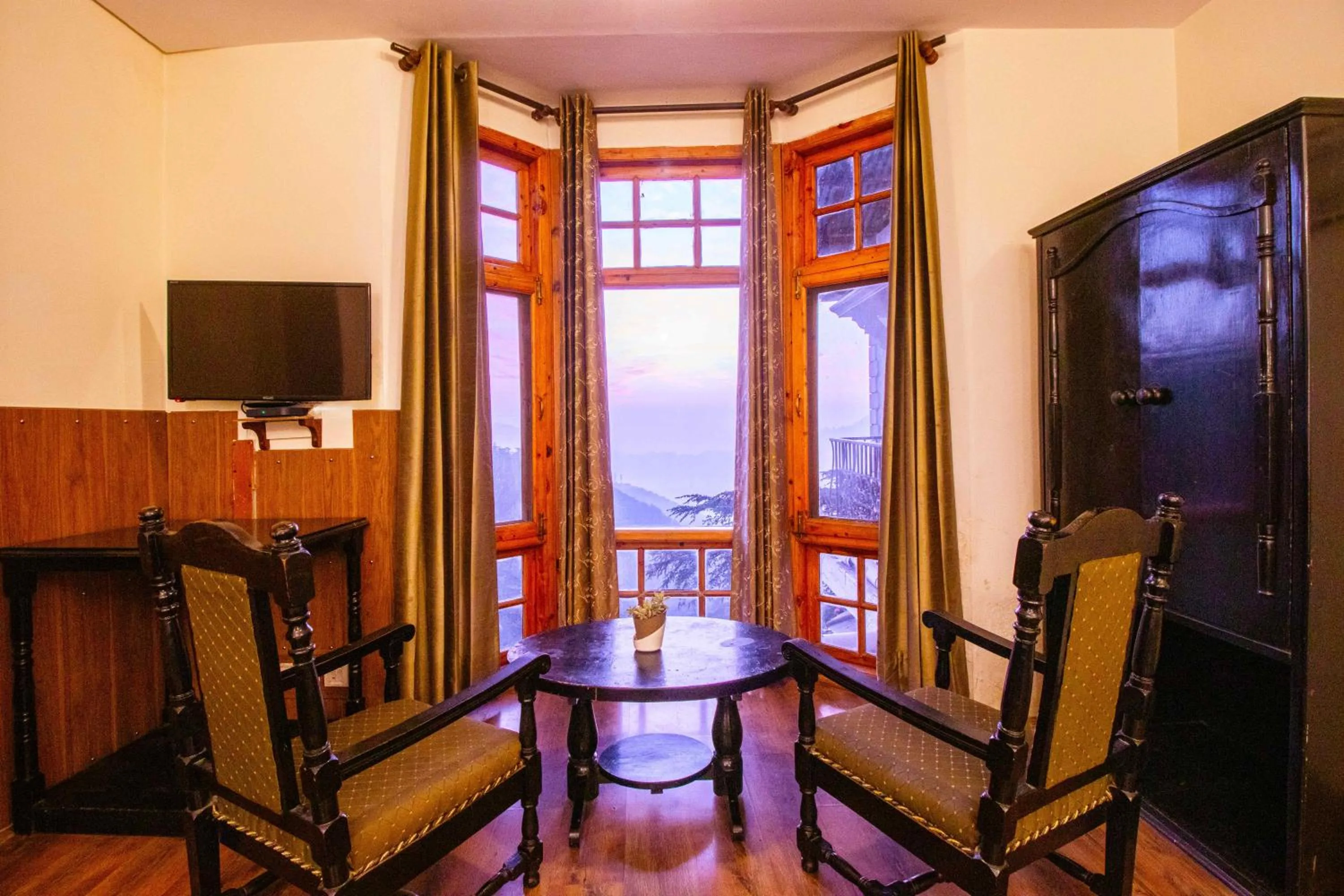 Seating area in Treebo The Alpine Heritage Residency