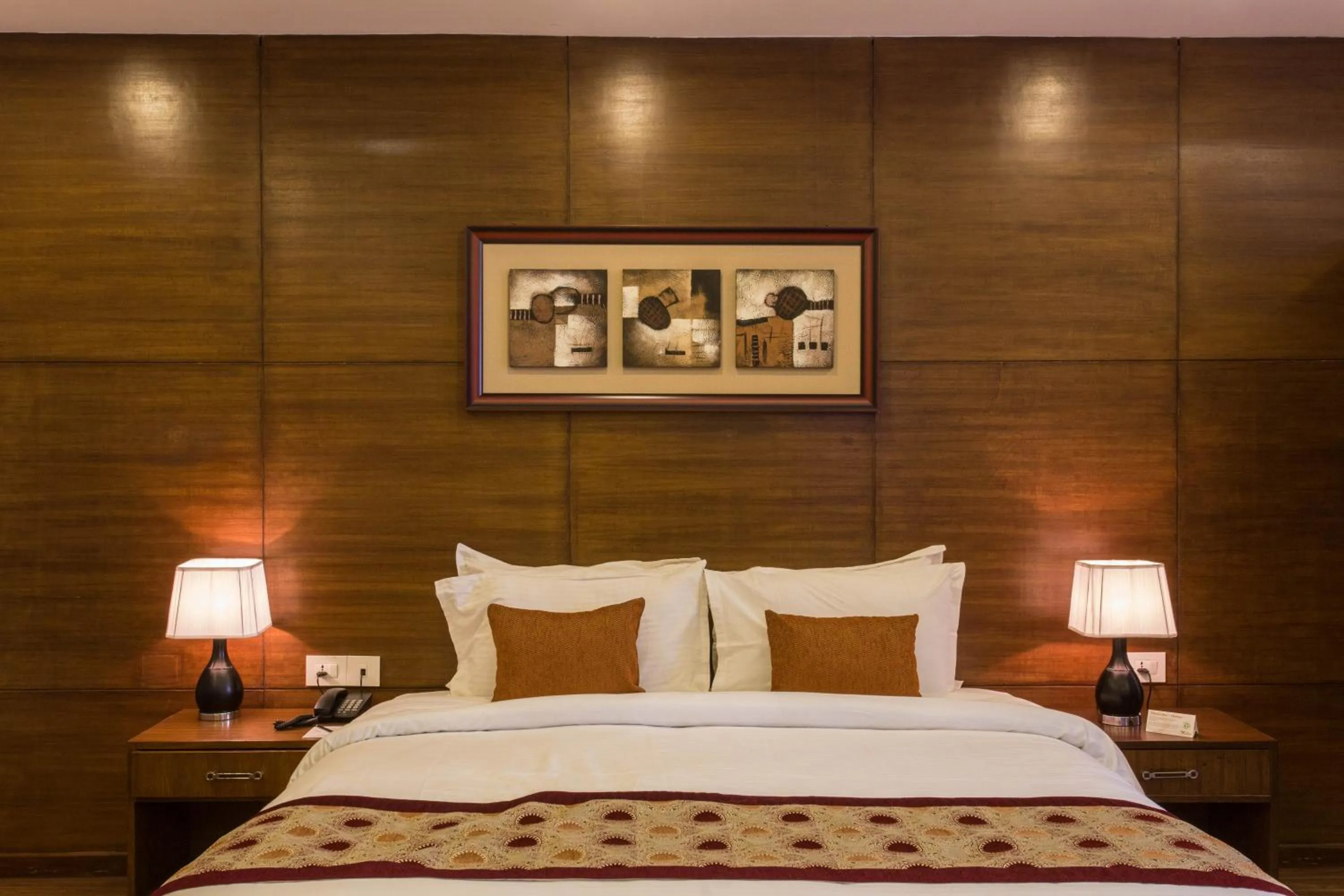 Bed in Yatri Suites and Spa