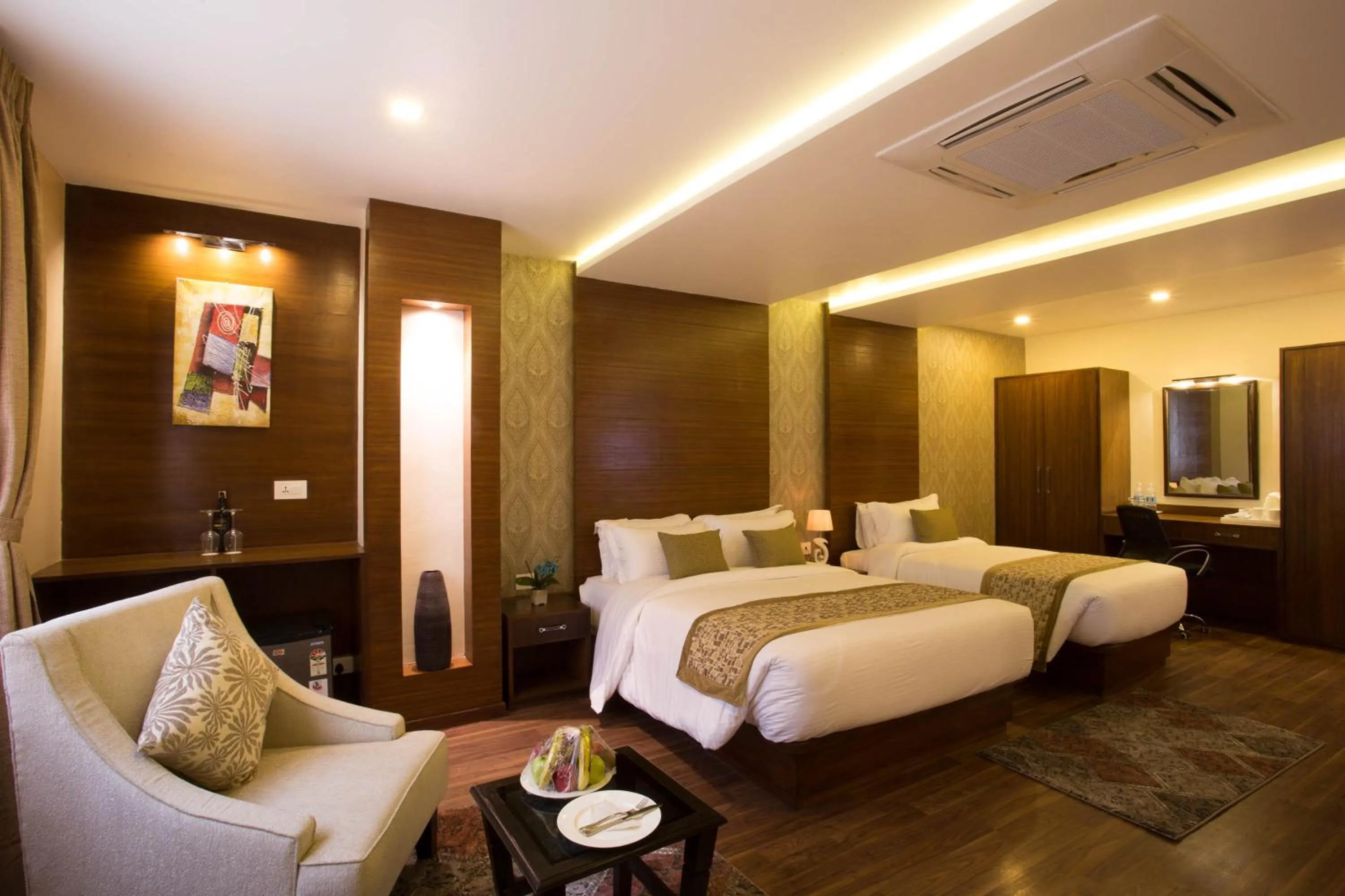 Bed in Yatri Suites and Spa