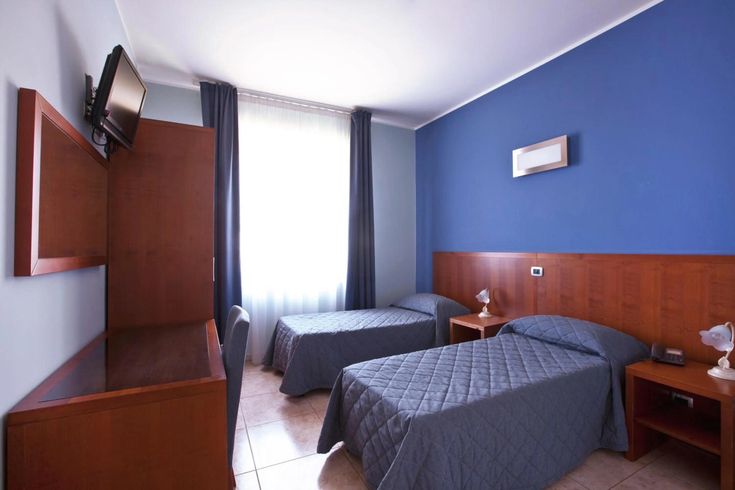 Bedroom in Hotel San Martino