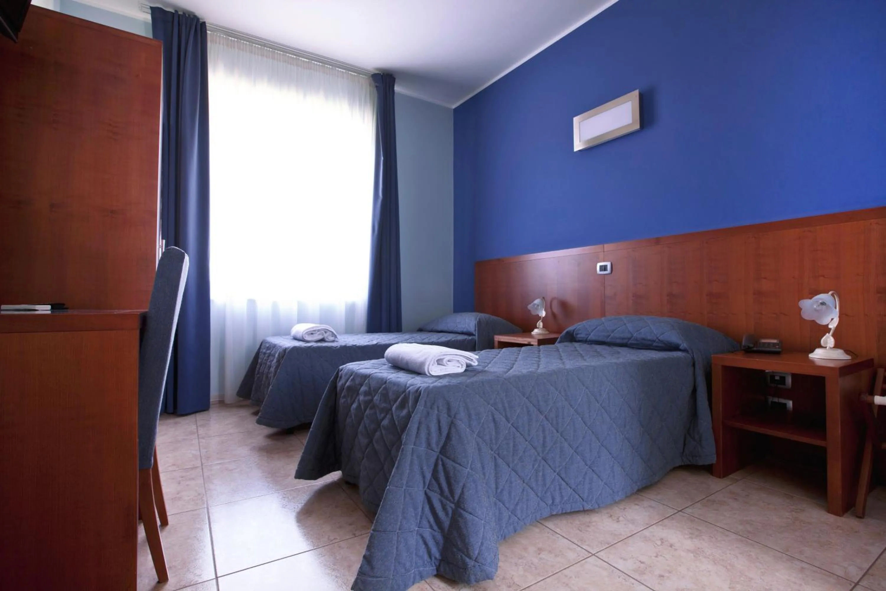 Bedroom in Hotel San Martino