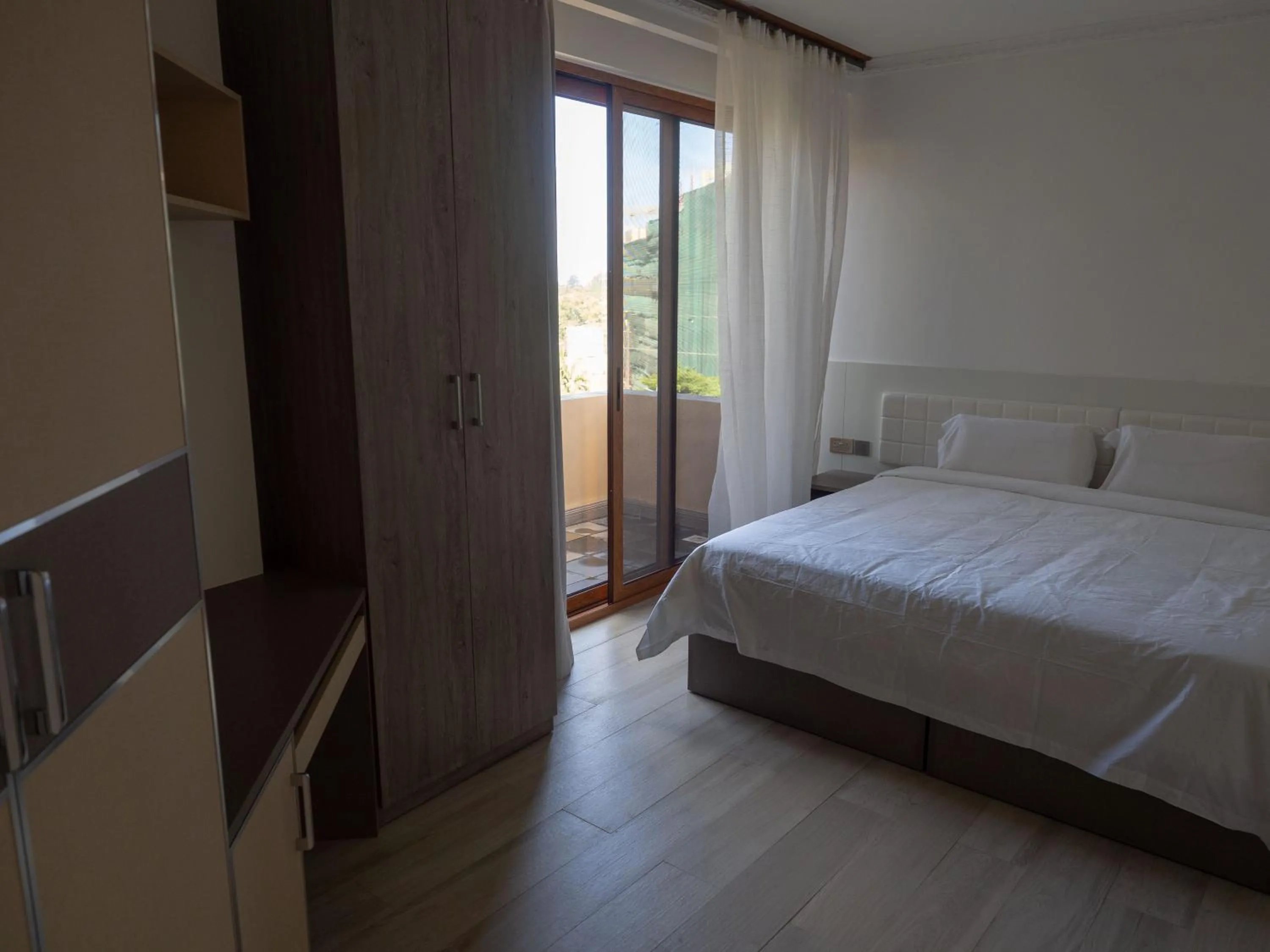 Bed in Kates Apartments