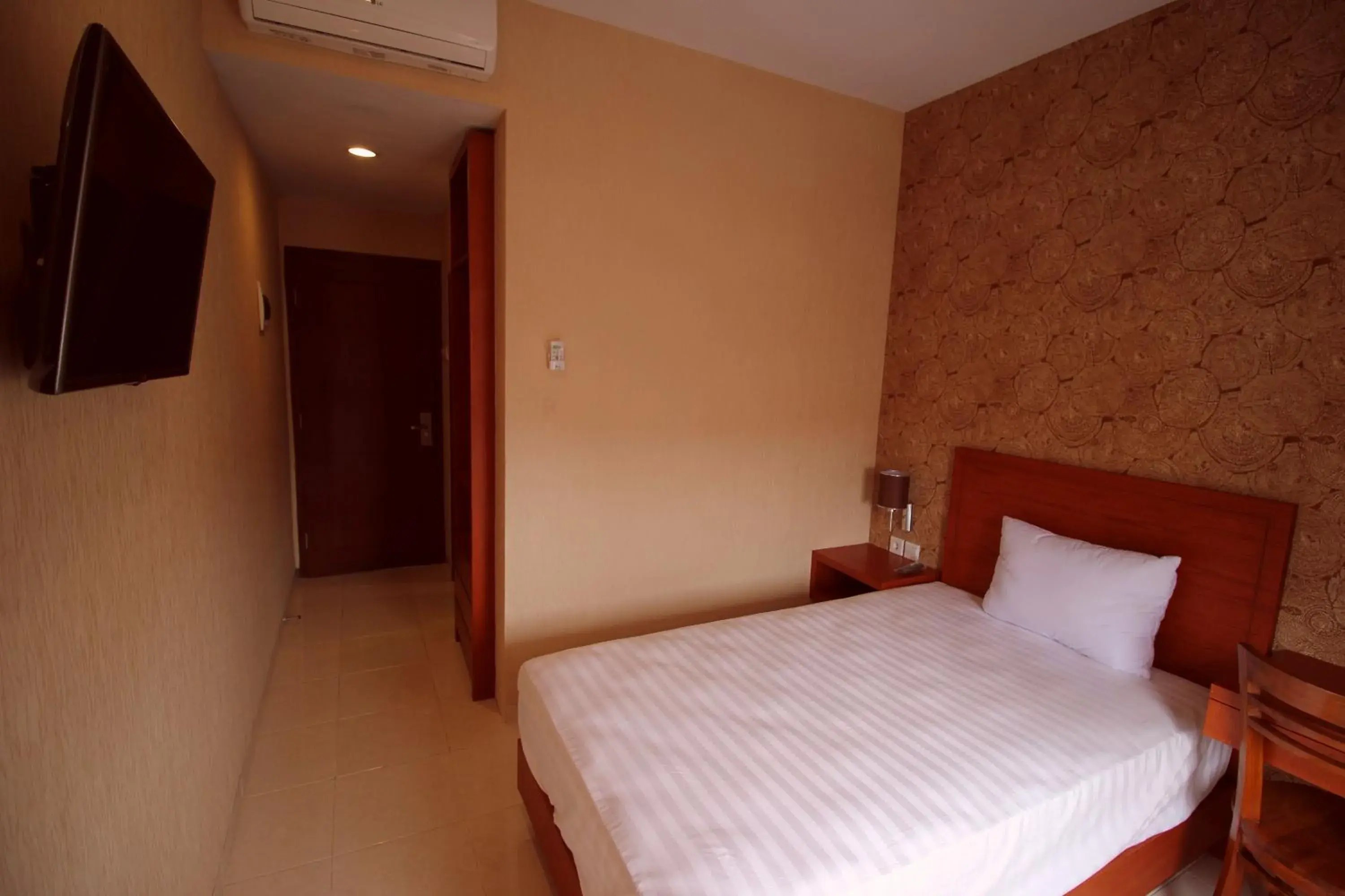 Bed in Amaya Suites Hotel