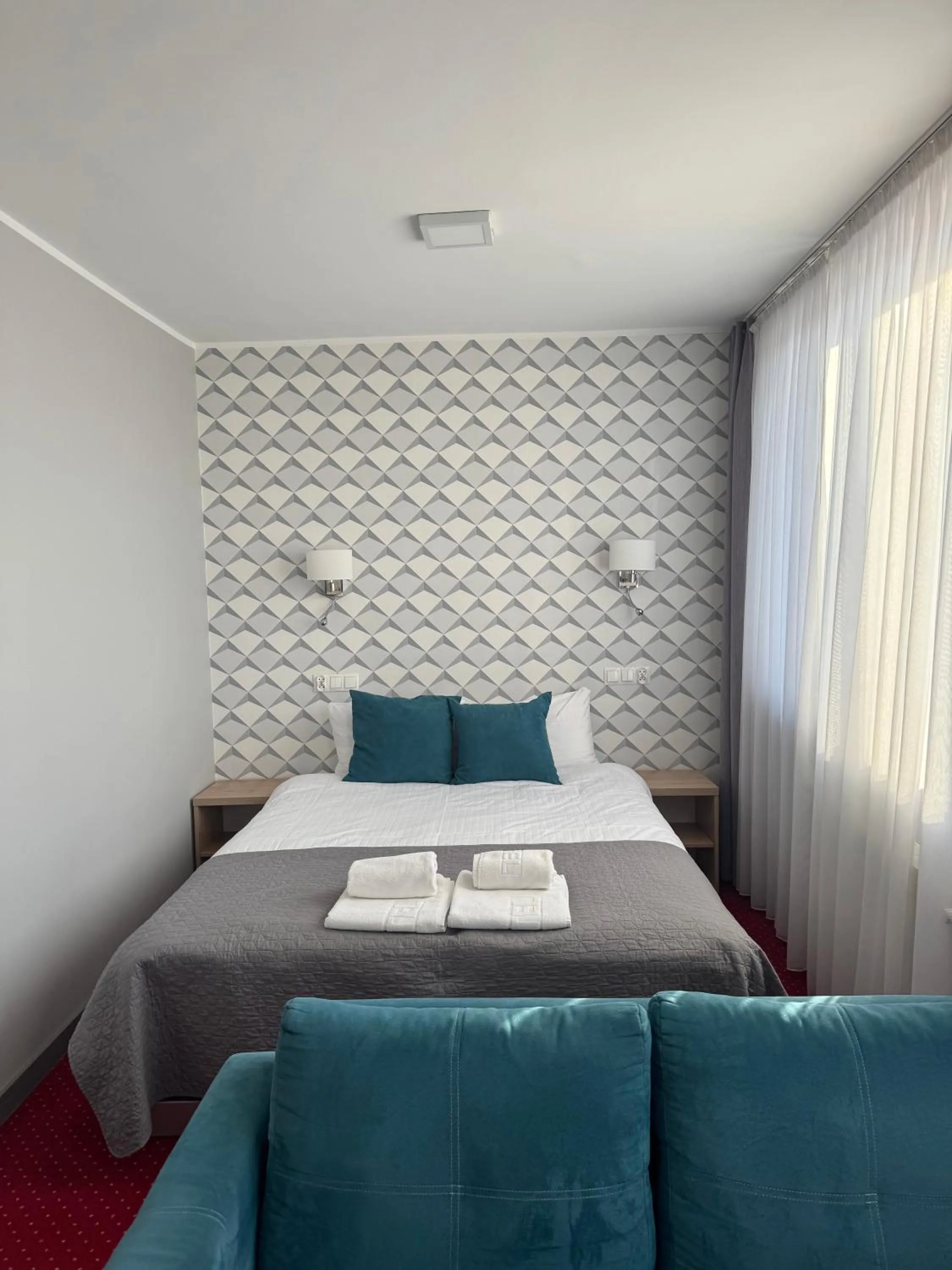 Photo of the whole room, Bed in Carina Hotel