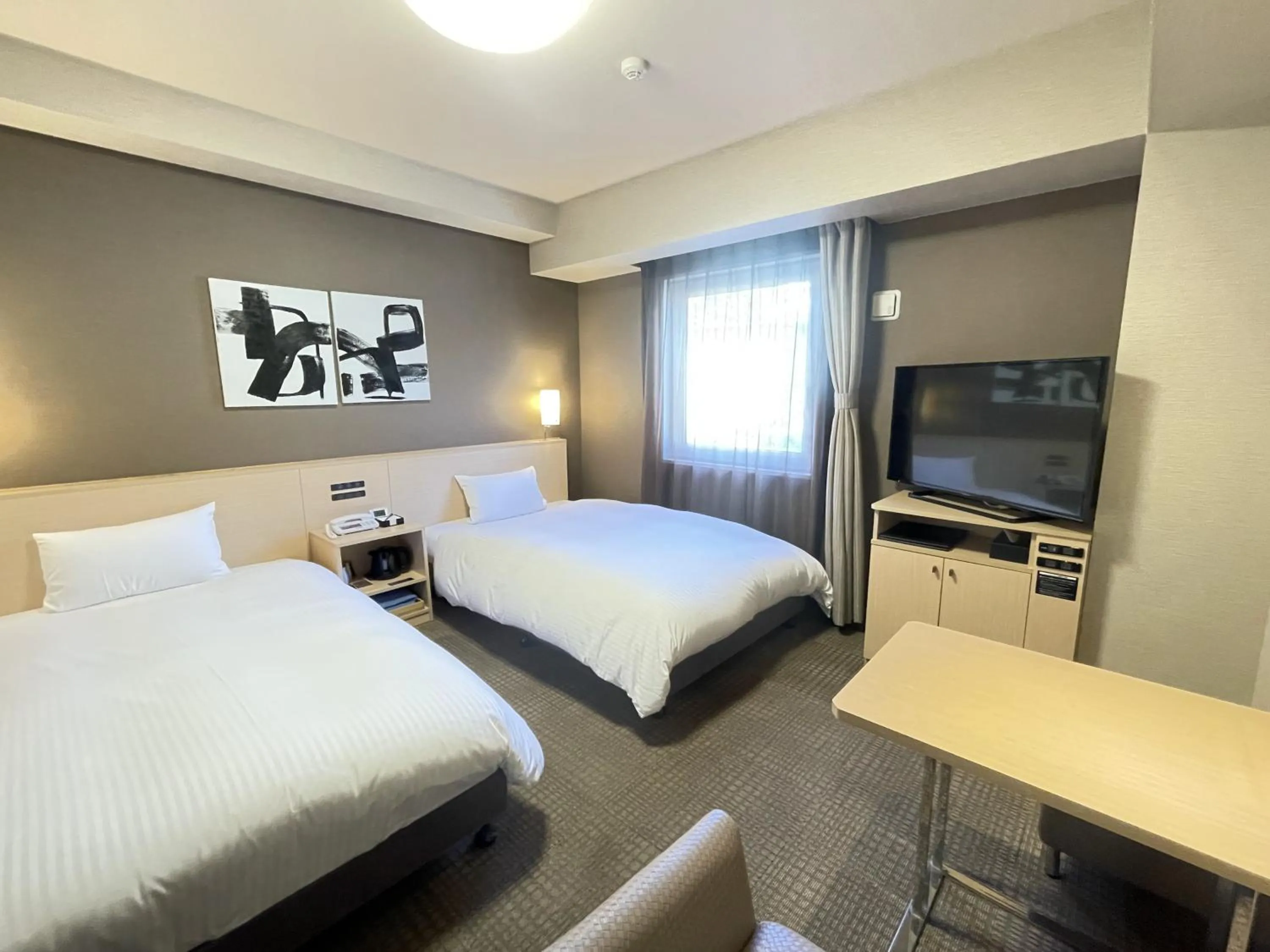 Photo of the whole room, Bed in Hotel Route Inn Grand Ueda Ekimae