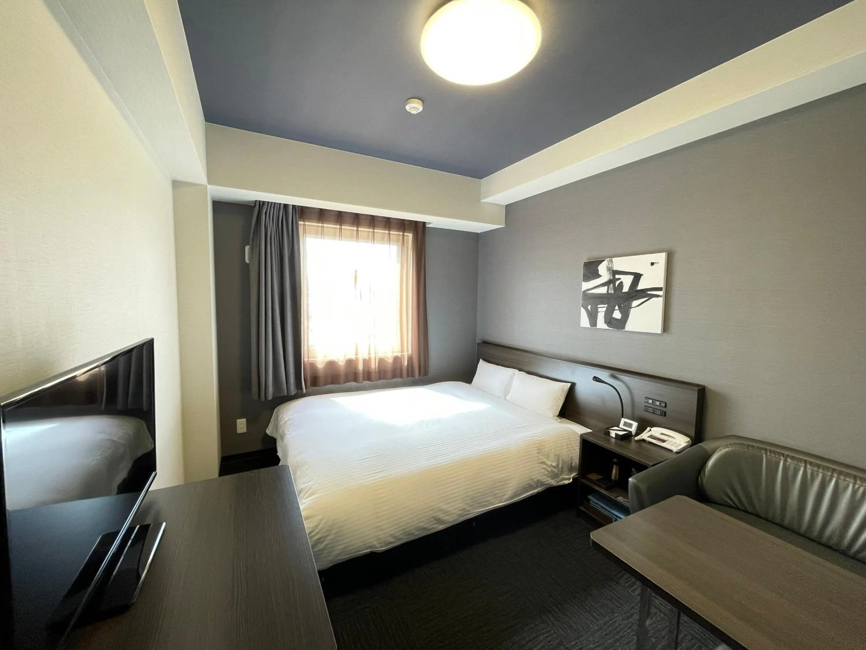 Photo of the whole room, Bed in Hotel Route Inn Grand Ueda Ekimae