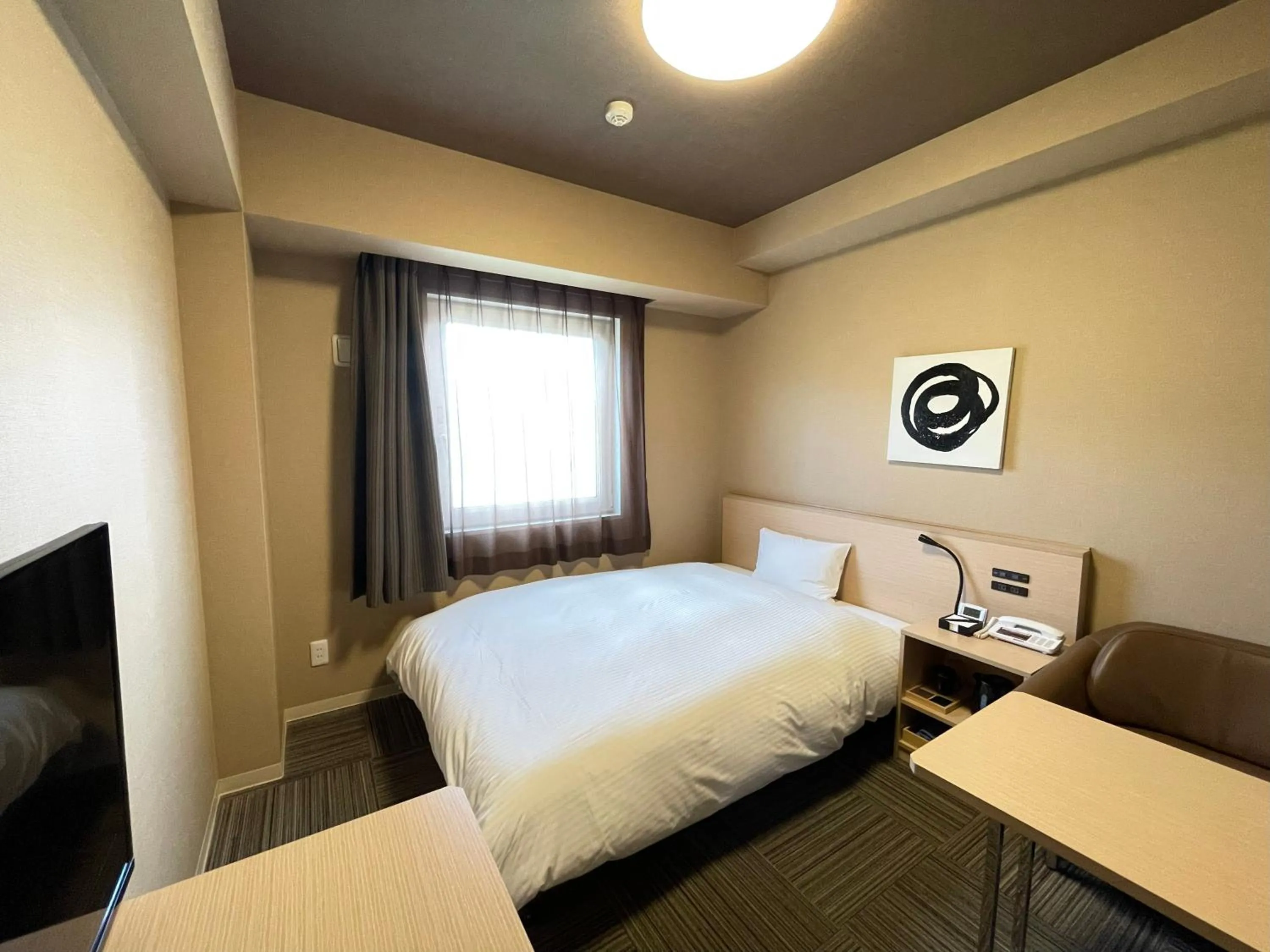 Photo of the whole room, Bed in Hotel Route Inn Grand Ueda Ekimae