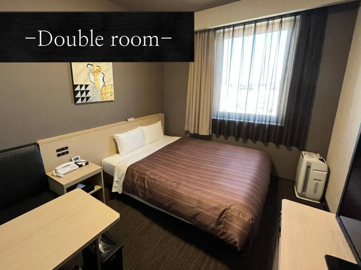 Bed in Hotel Route Inn Grand Asahikawa Ekimae