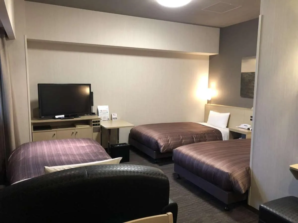 Bed in Hotel Route Inn Grand Asahikawa Ekimae