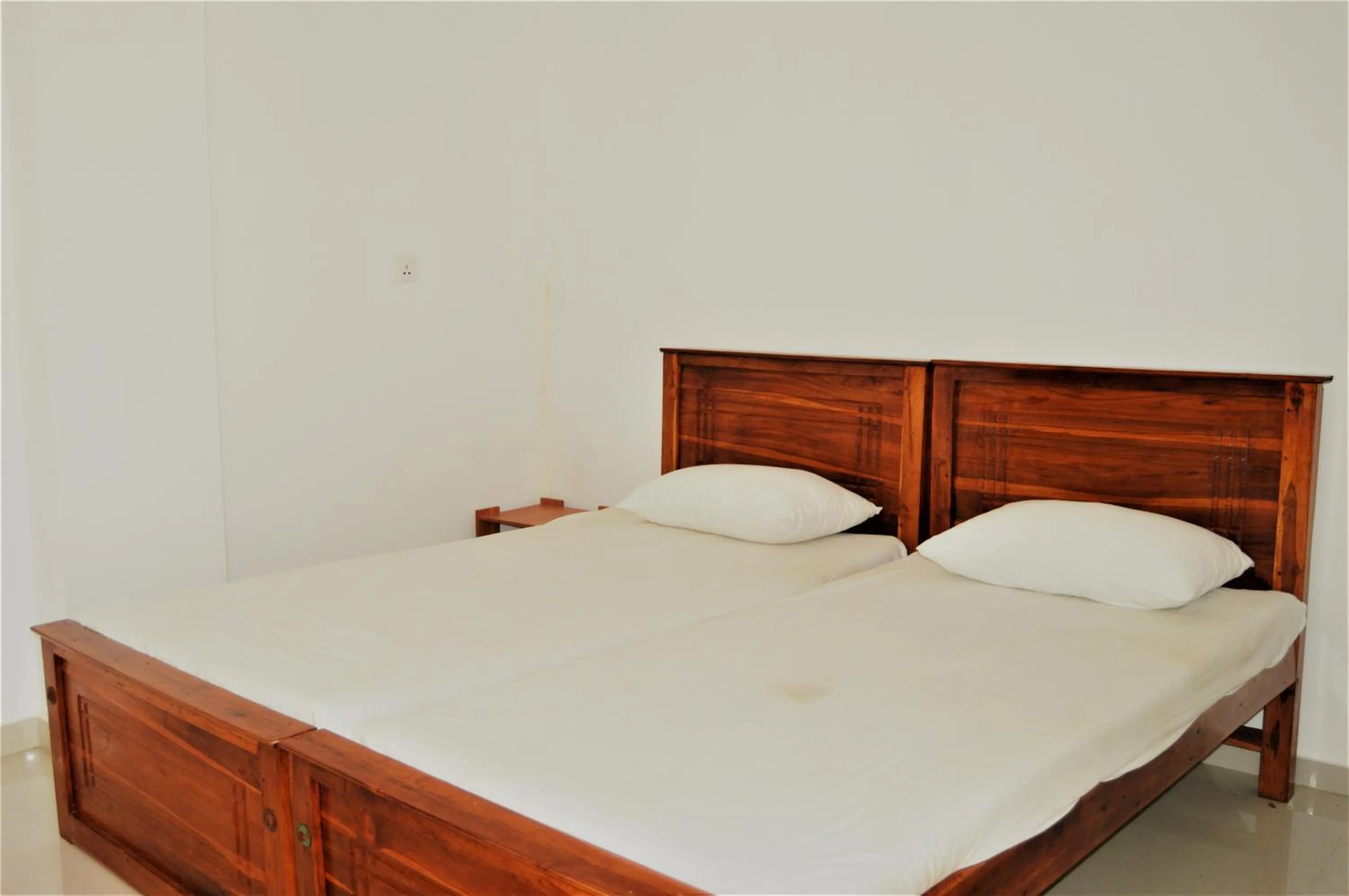 Bed in Shim Beach Resort