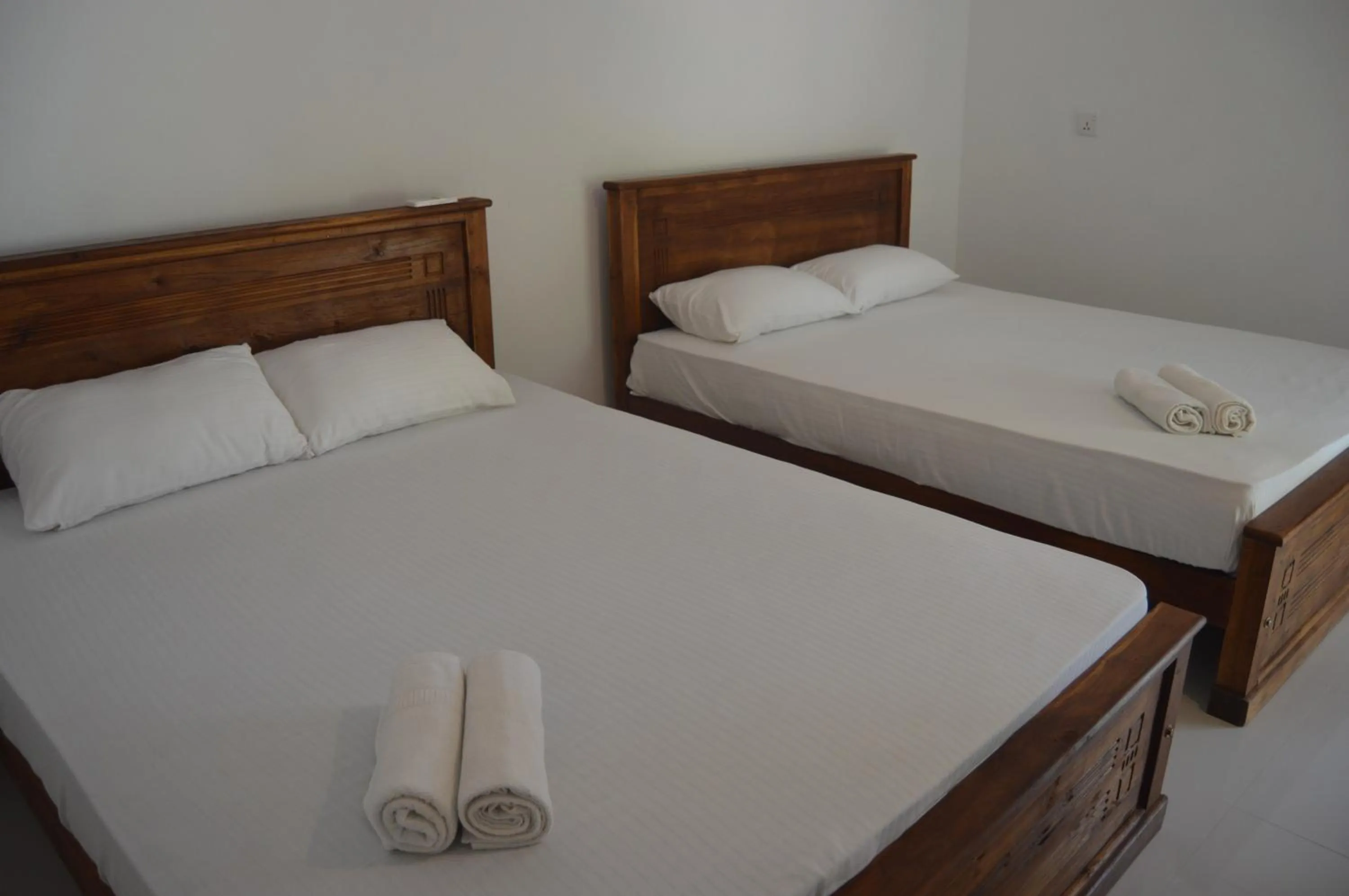 Bed in Shim Beach Resort