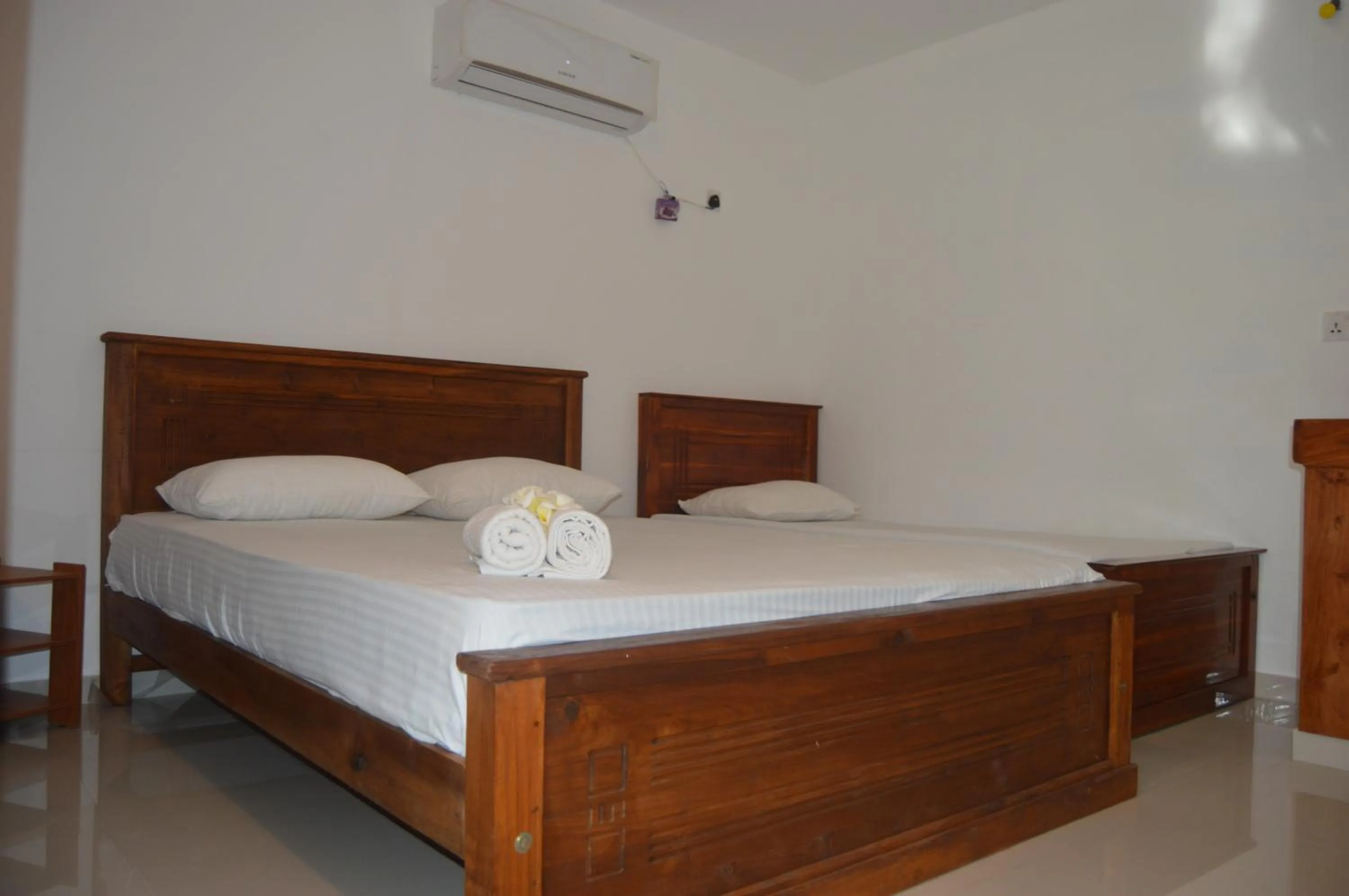 Bed in Shim Beach Resort