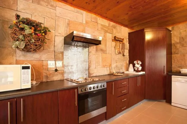 Communal kitchen in Quest Bed And Breakfast