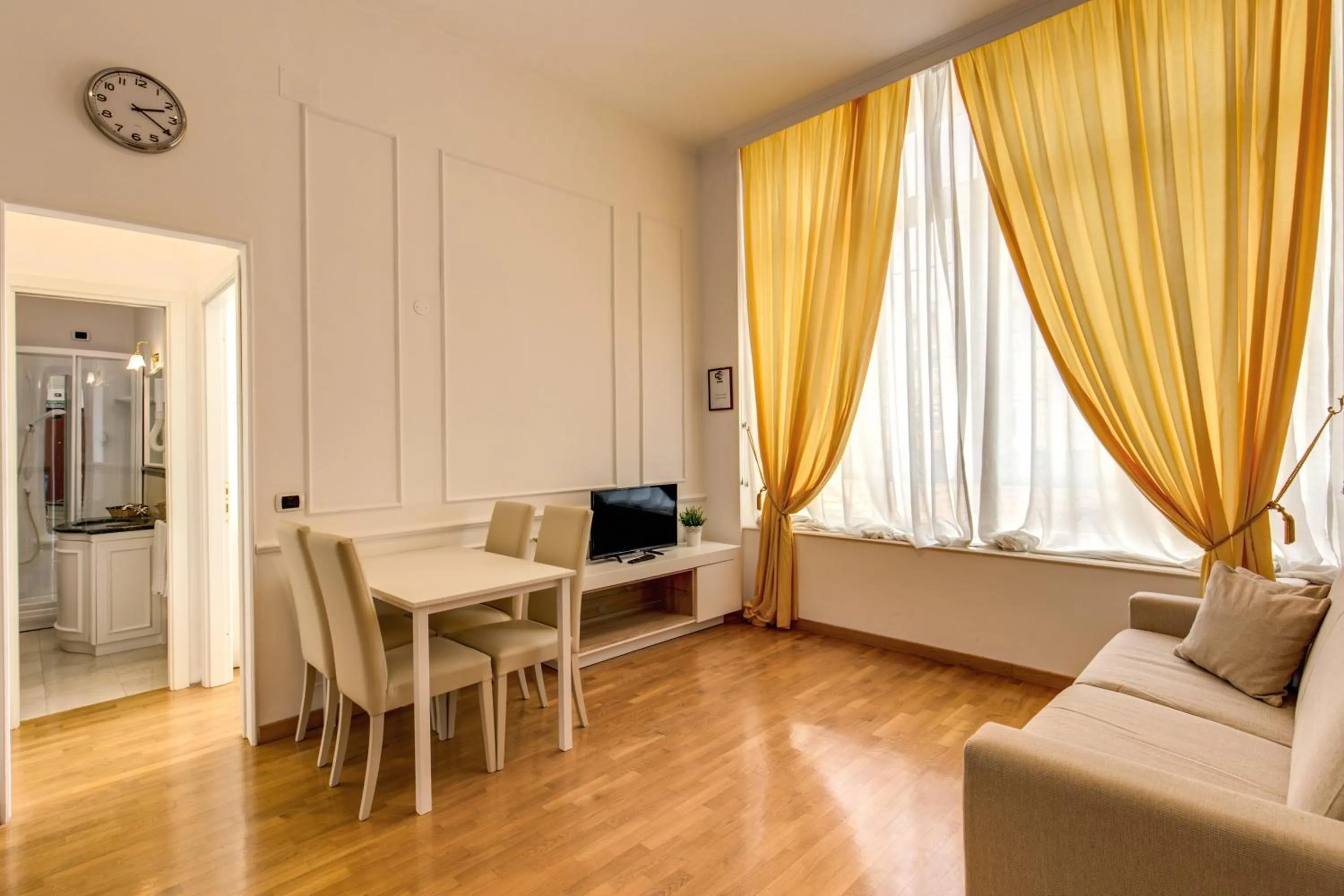Seating area in Apollo Apartments Colosseo