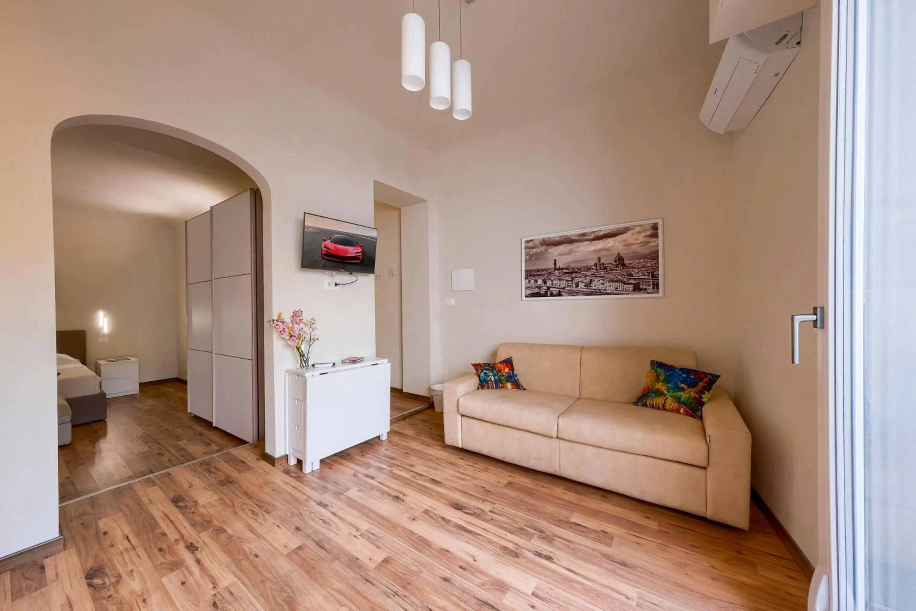 Living room, Bed in Home Boutique Santa Maria Novella