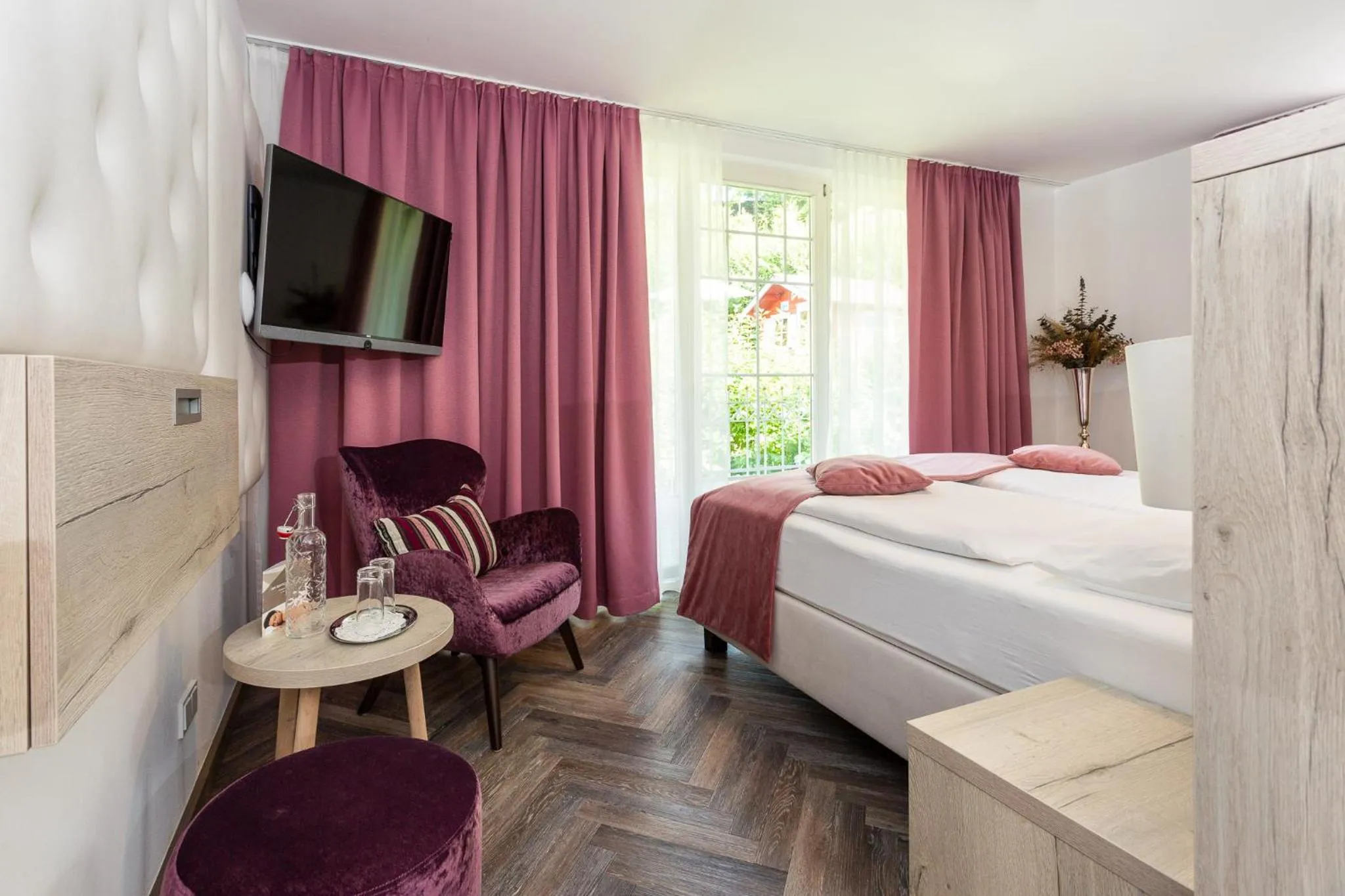 Photo of the whole room, Bed in Boutiquehotel Bergvilla