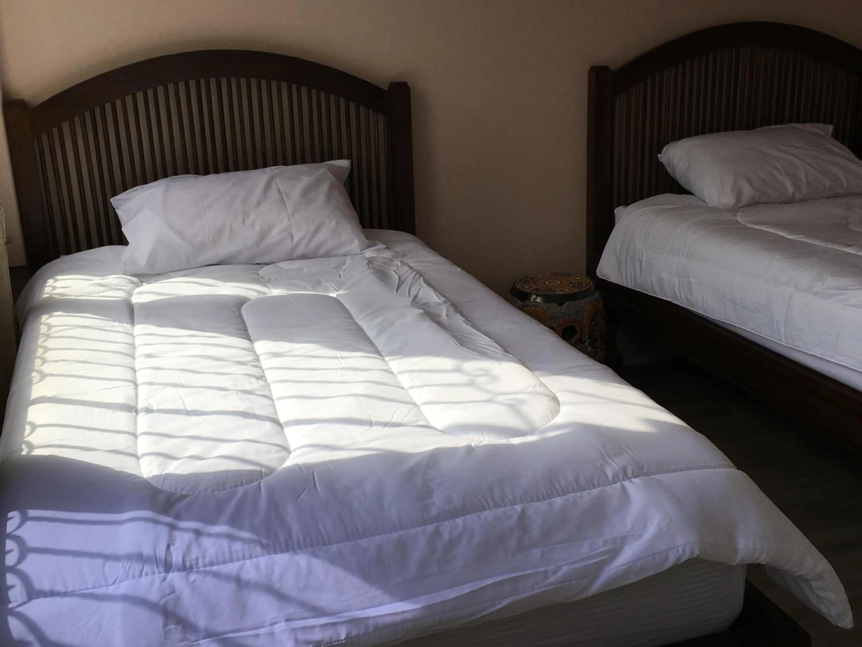 Bed in The Grand Palace Hotel