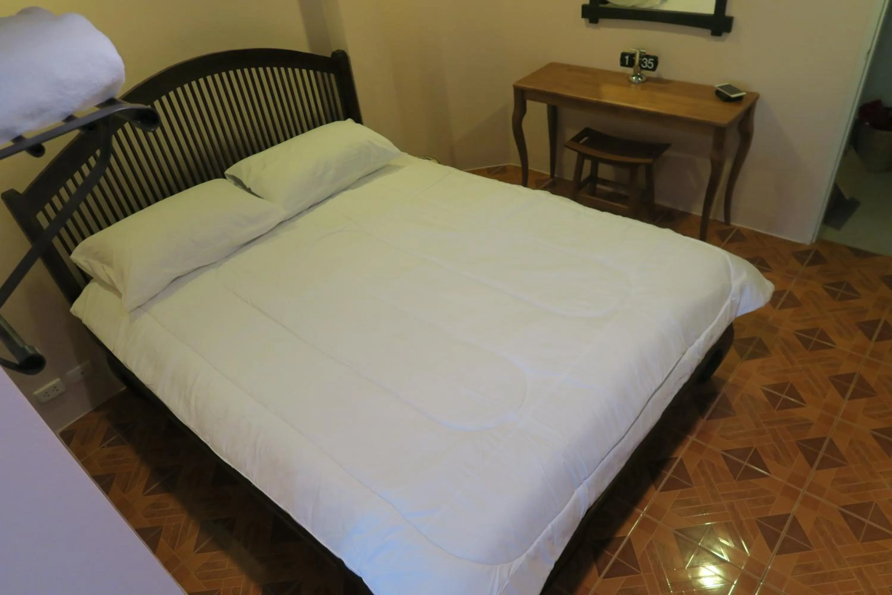 Bed in The Grand Palace Hotel