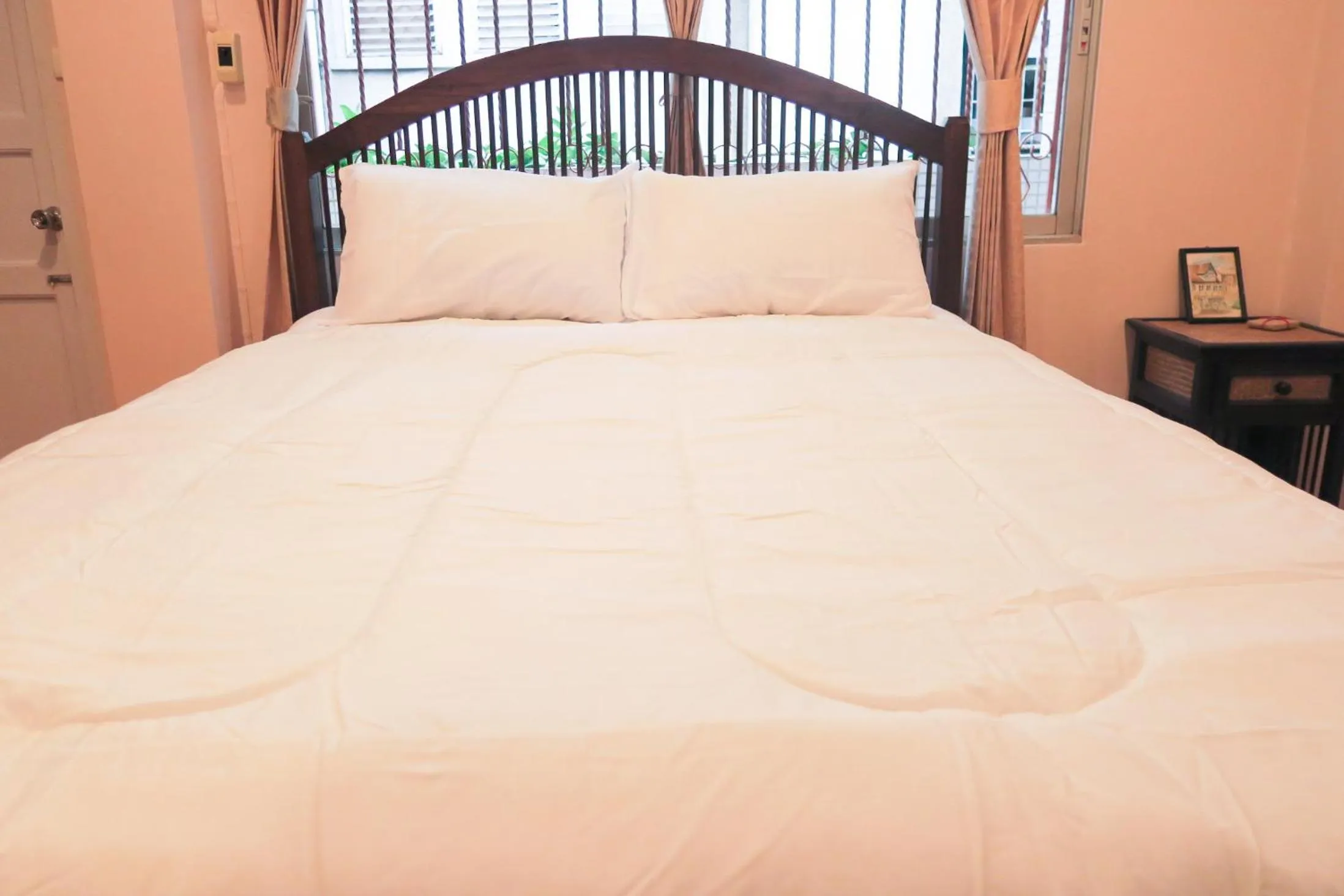 Bed in The Grand Palace Hotel