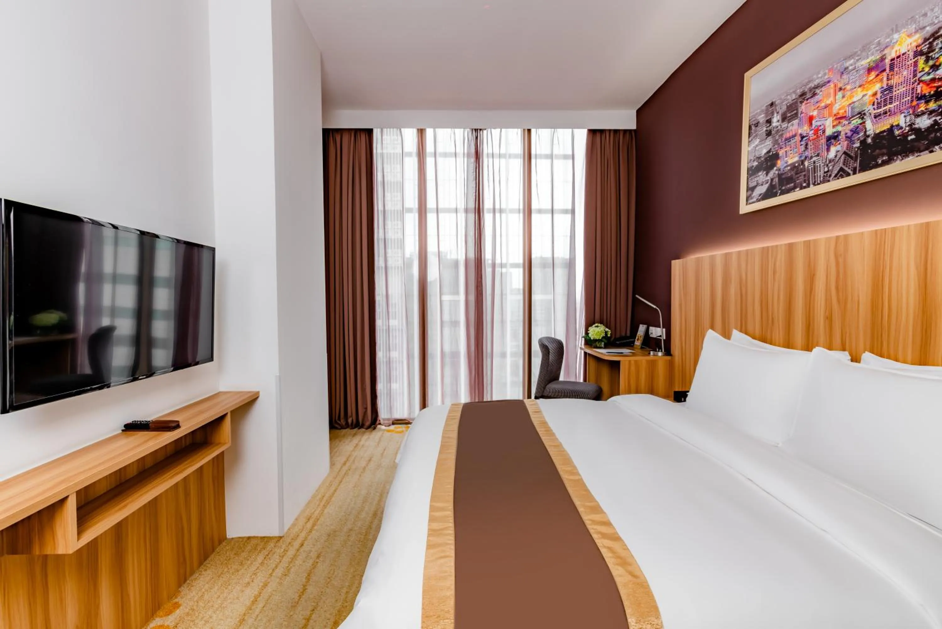 Communal lounge/ TV room, Bed in Bay Hotel Ho Chi Minh