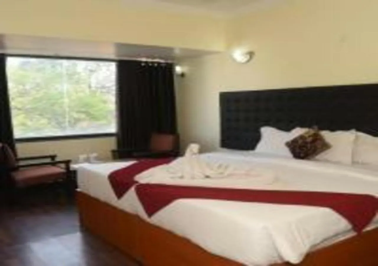 Bed in Hotel Rajhans International