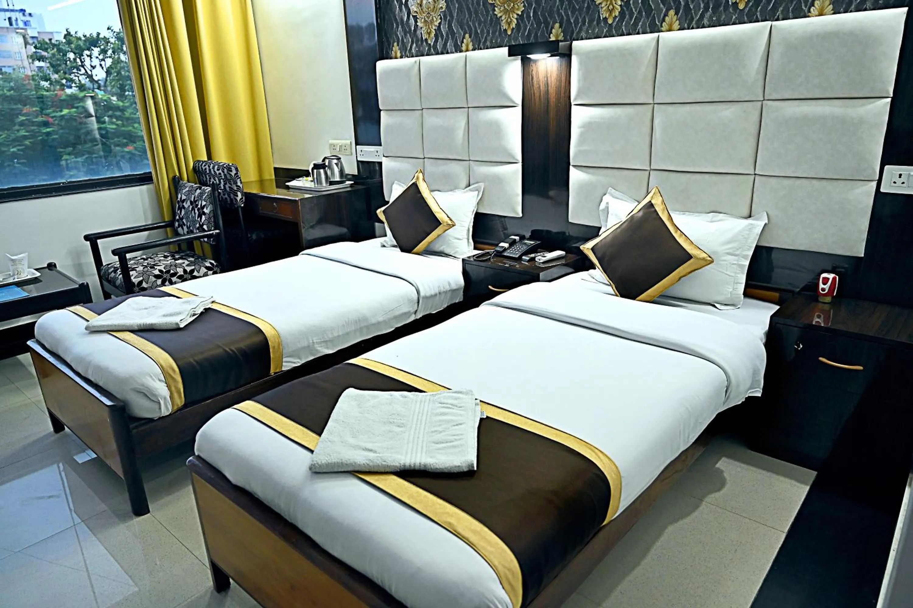 Bed in Hotel Rajhans International