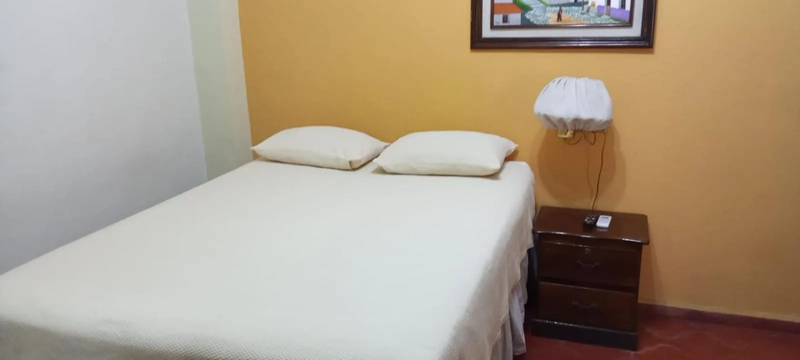 Bed in Hotel Acropolis Maya