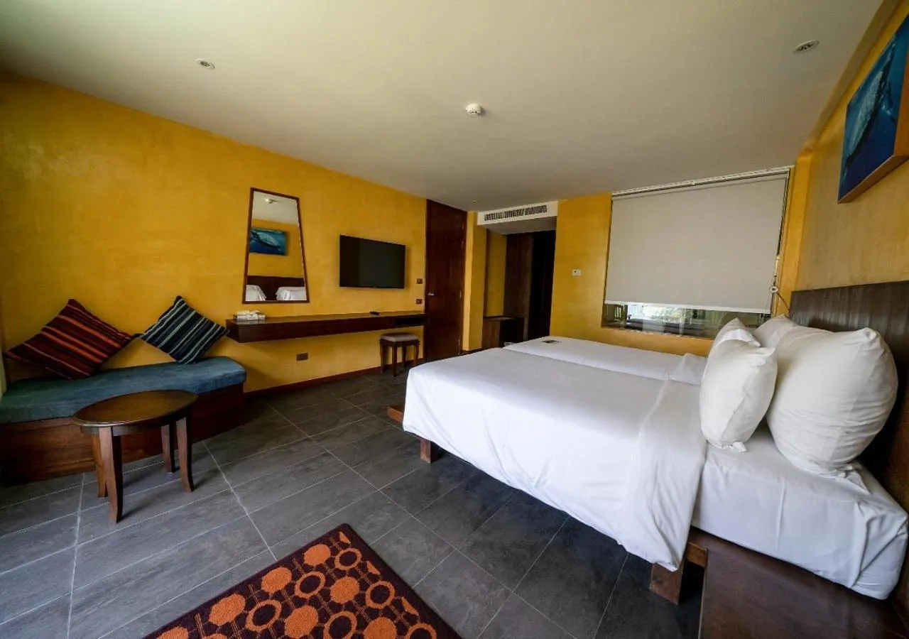 Photo of the whole room, Bed in Coriacea Beachfront Boutique Phuket Resort