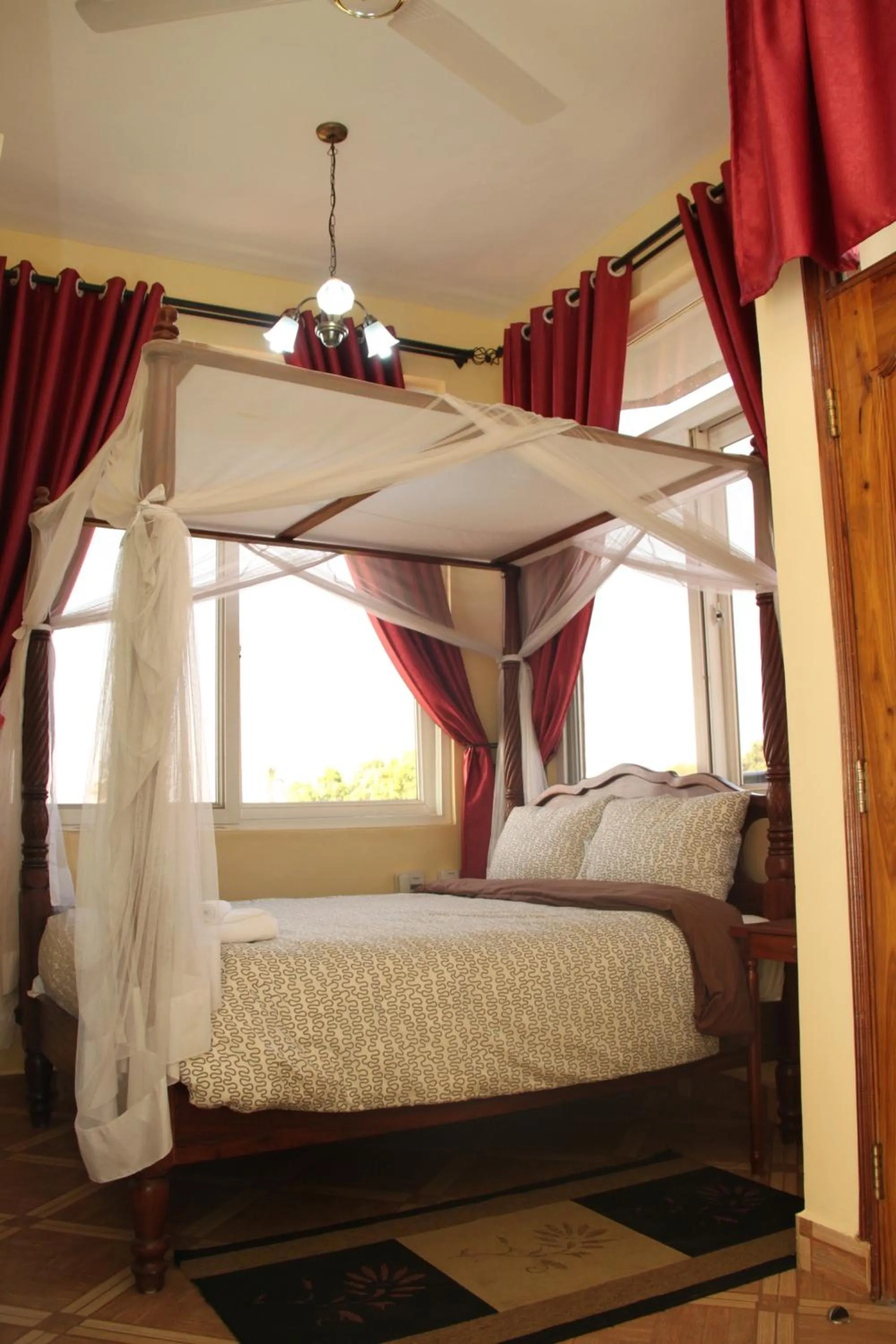 Bed in East Point Hotel Moshi