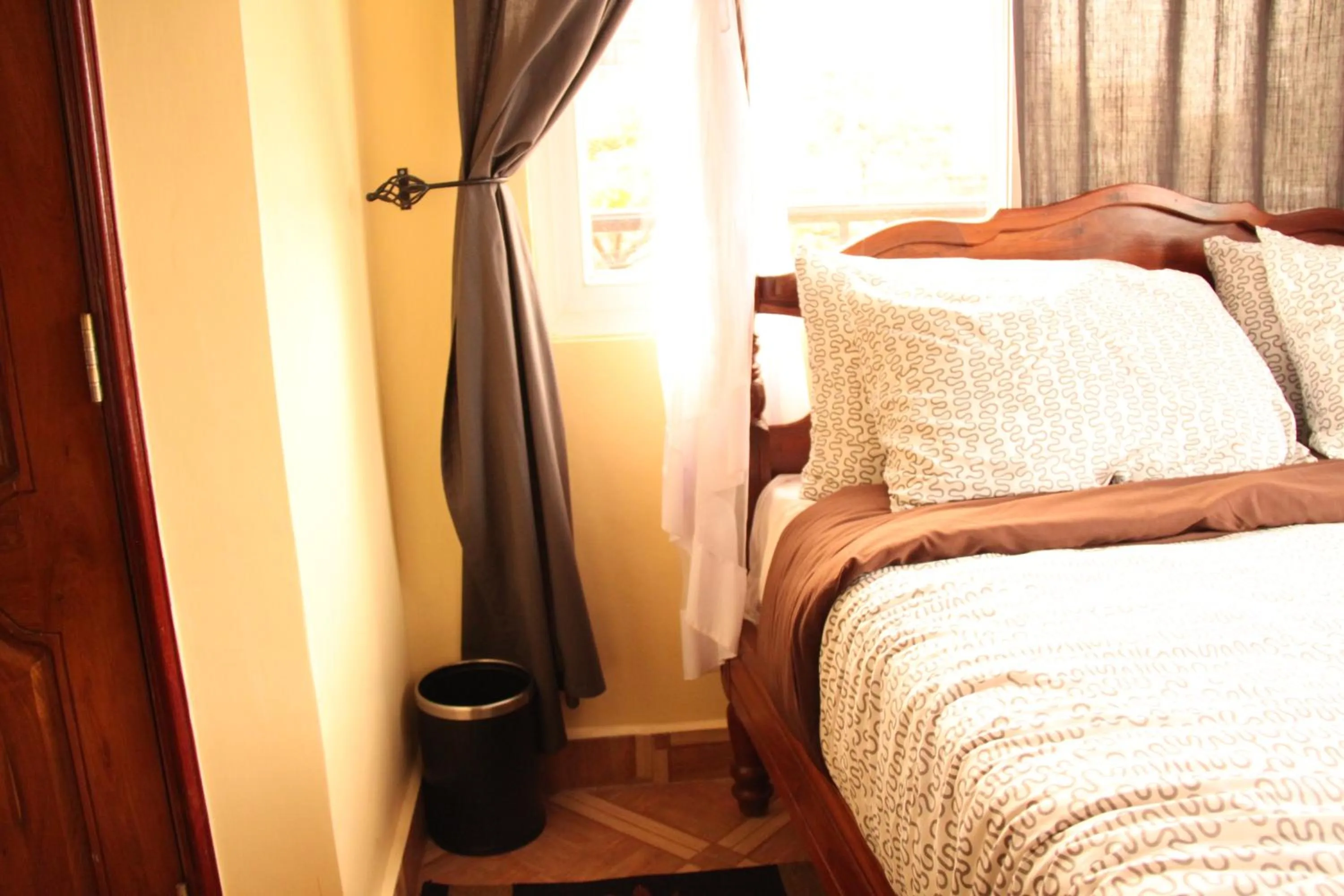 Bed in East Point Hotel Moshi