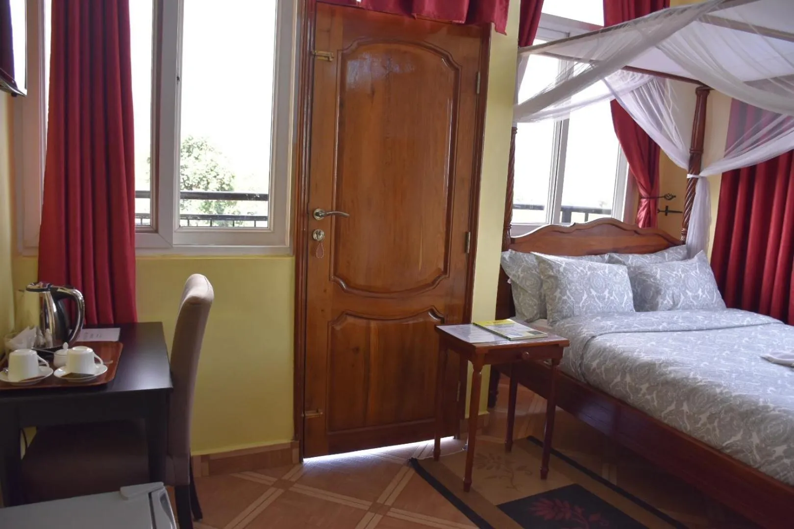 Bed in East Point Hotel Moshi