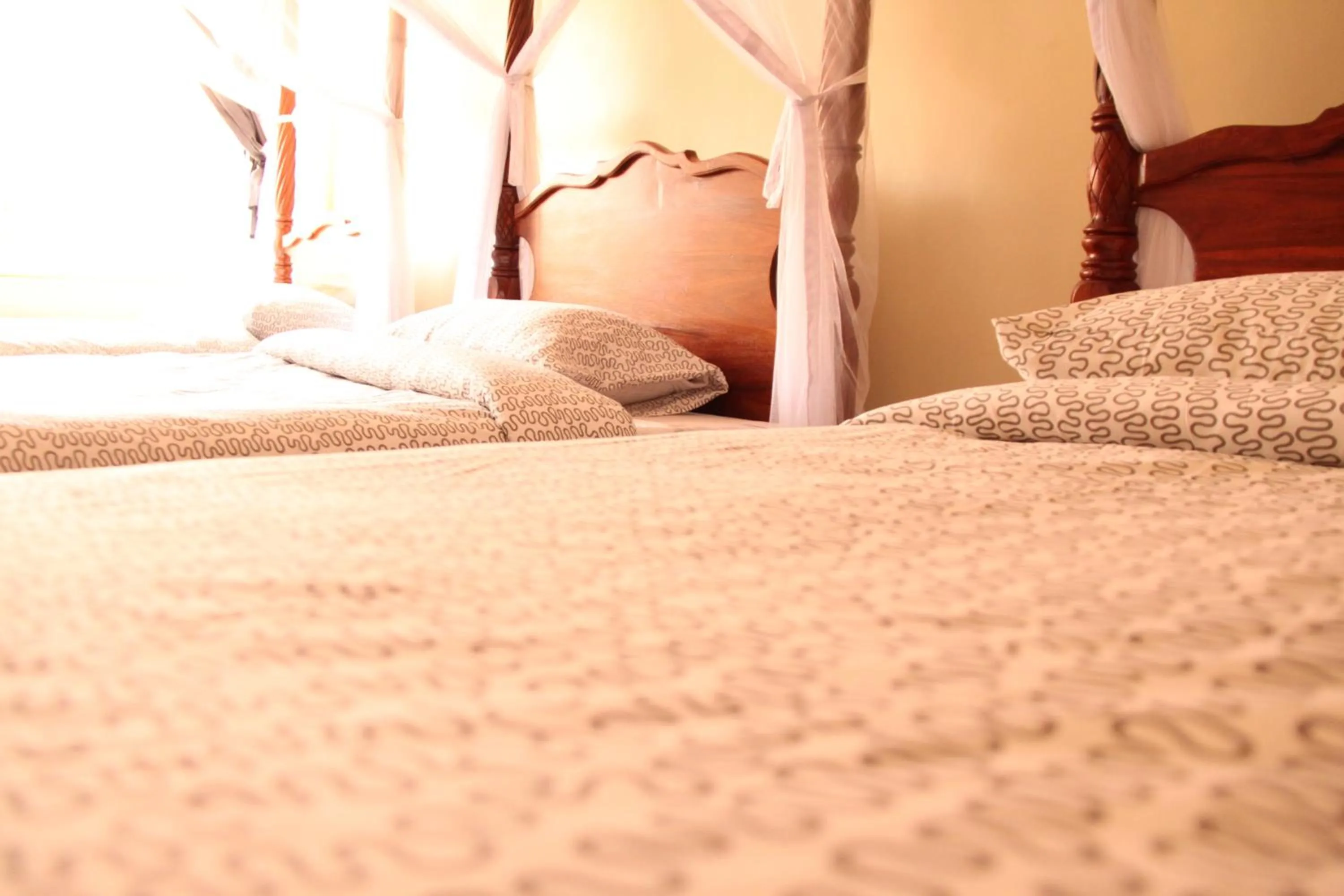 Bed in East Point Hotel Moshi