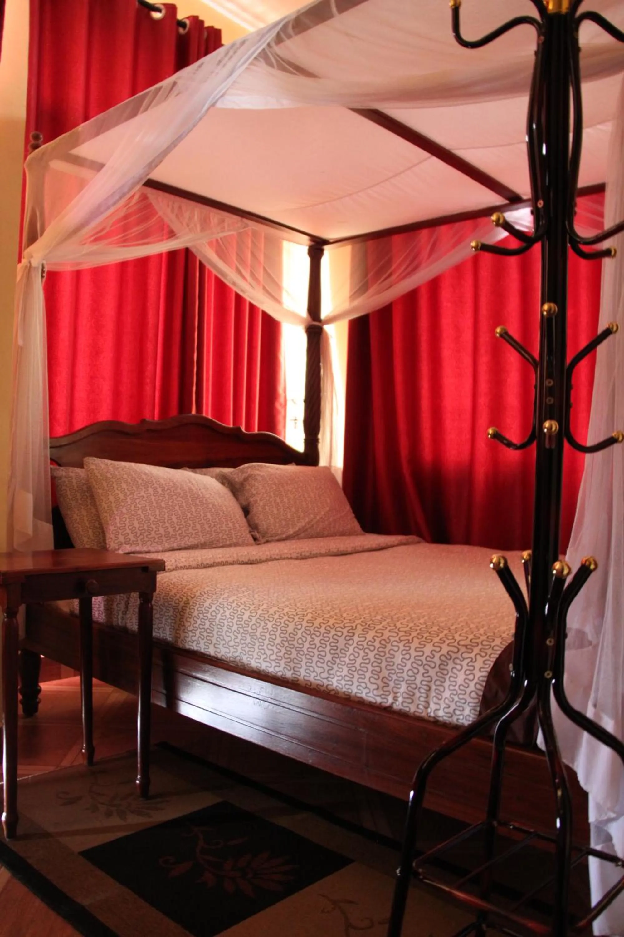 Bed in East Point Hotel Moshi