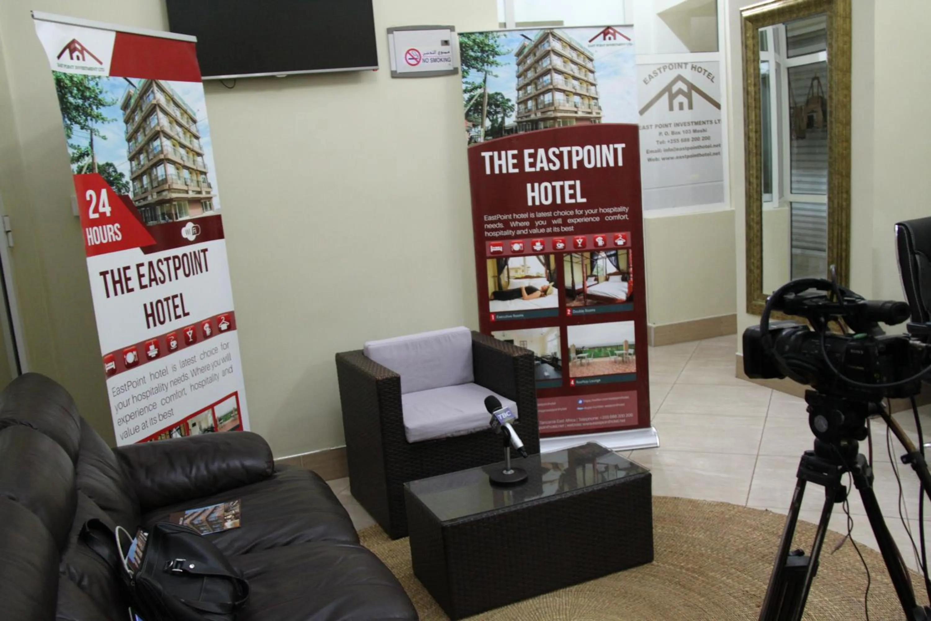 Communal lounge/ TV room in East Point Hotel Moshi