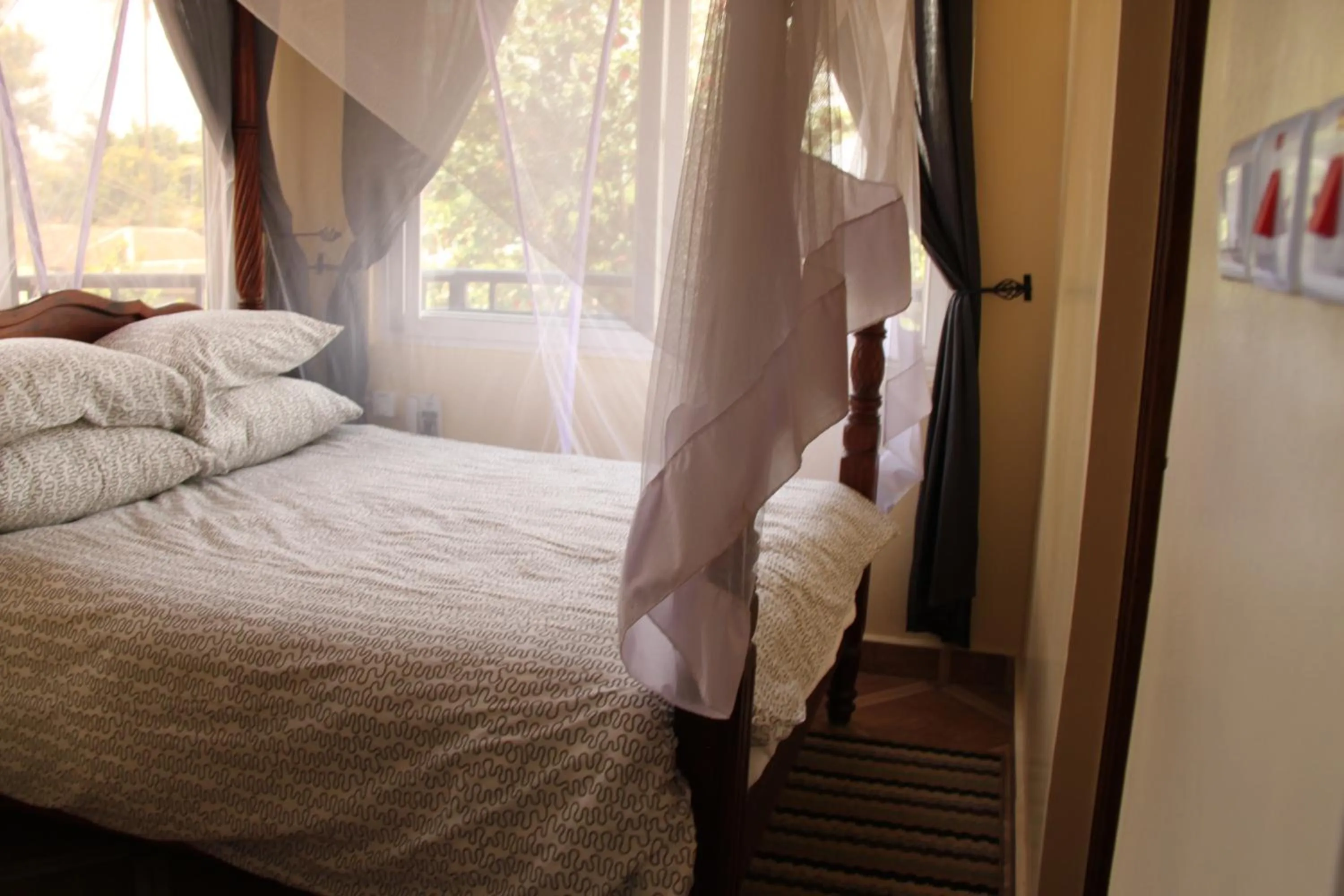 Bed in East Point Hotel Moshi